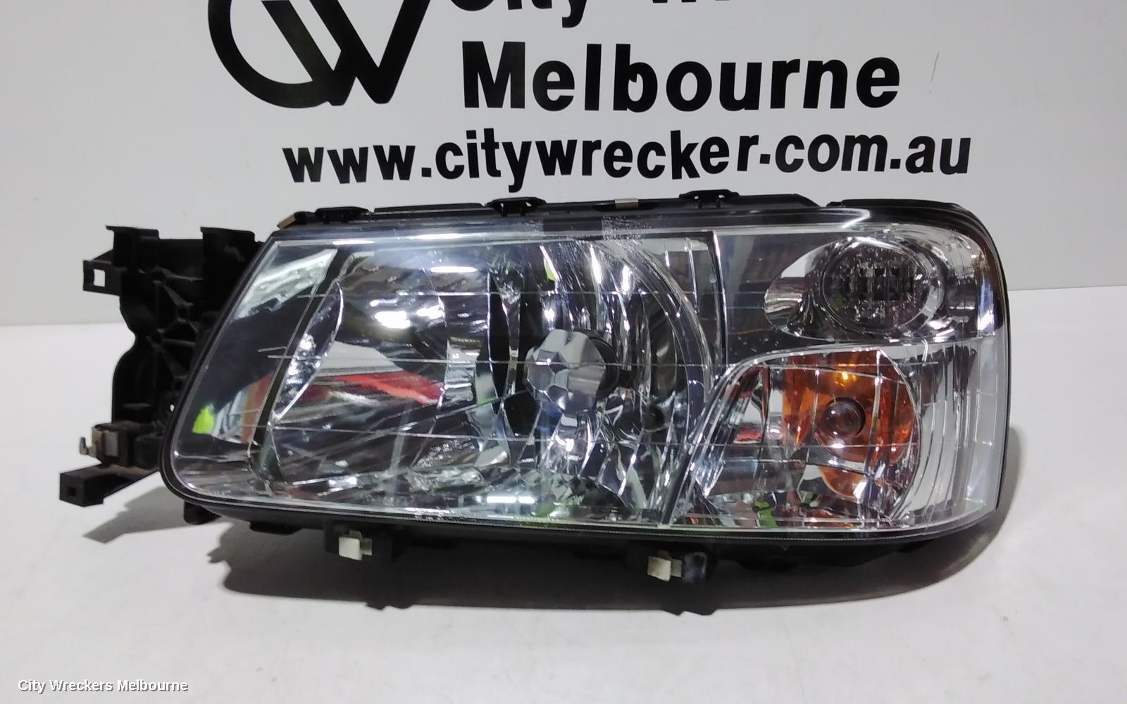 SUBARU FORESTER LEFT HEADLAMP, CHROME INSERT, LENS# 1703, 07/2002 - 07/2003