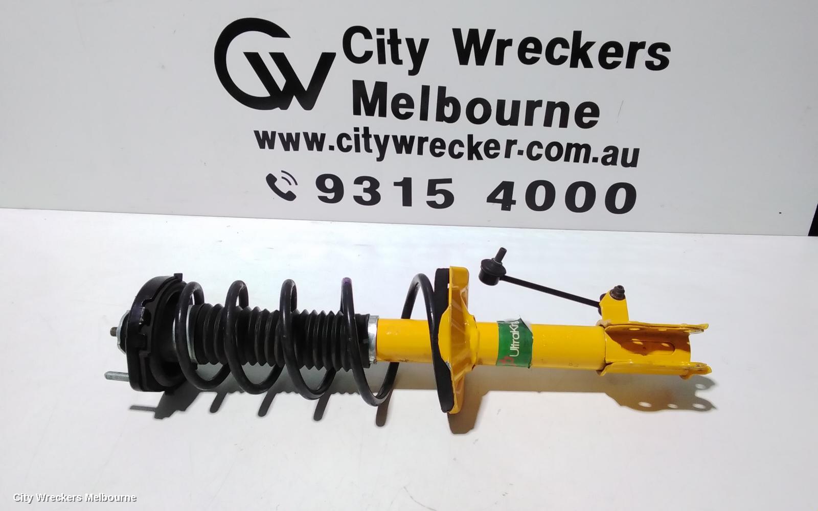 MAZDA 323 LEFT FRONT STRUT, BJ, 1.6/1.8, ZM/FP, LOW MOUNT SWAY BAR TYPE, 09/1998 - 12/2003