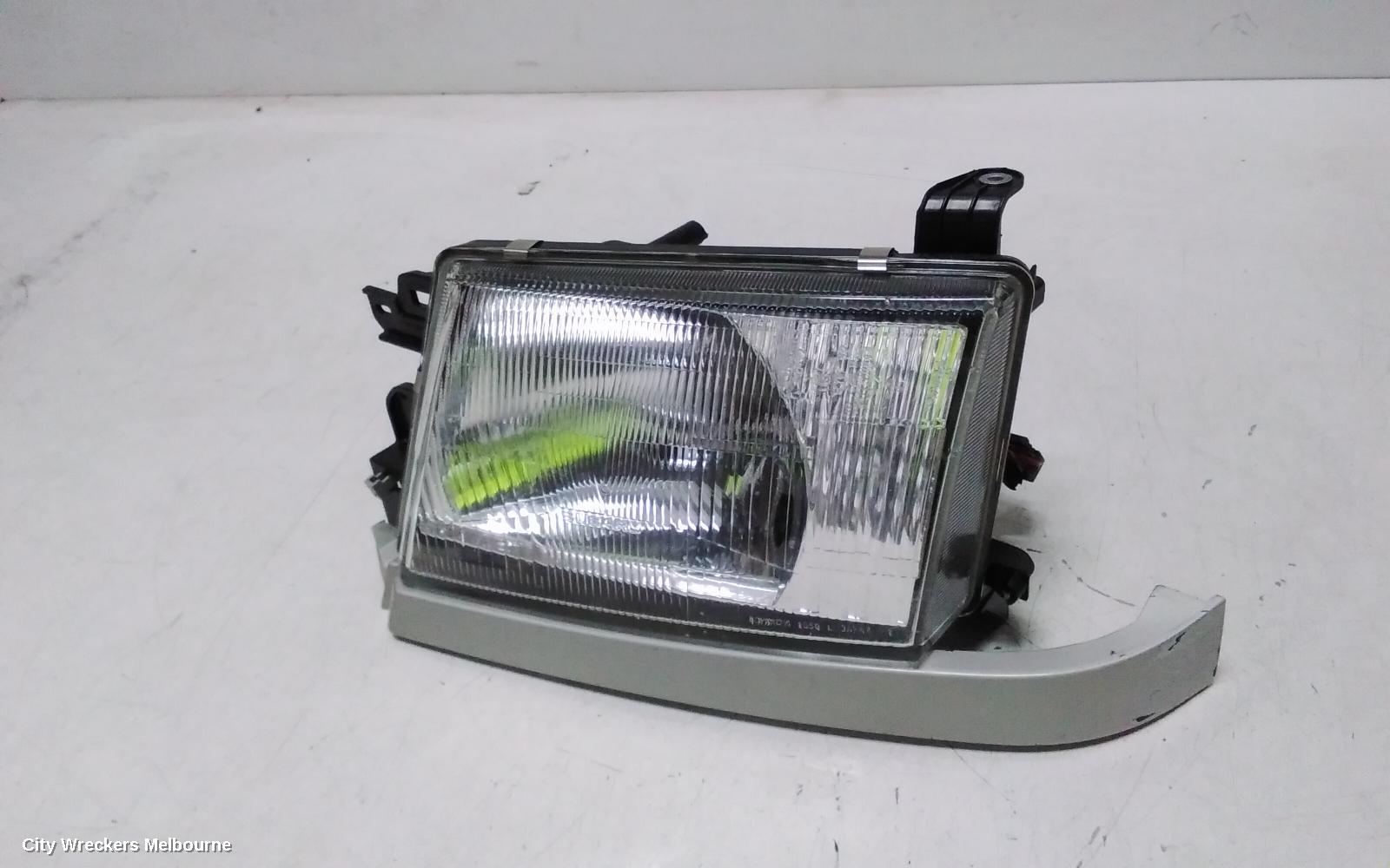 SUBARU FORESTER LEFT HEADLAMP, LENS ICHIKOH 1550, VIN JF2SF5..., 08/1997 - 01/2000