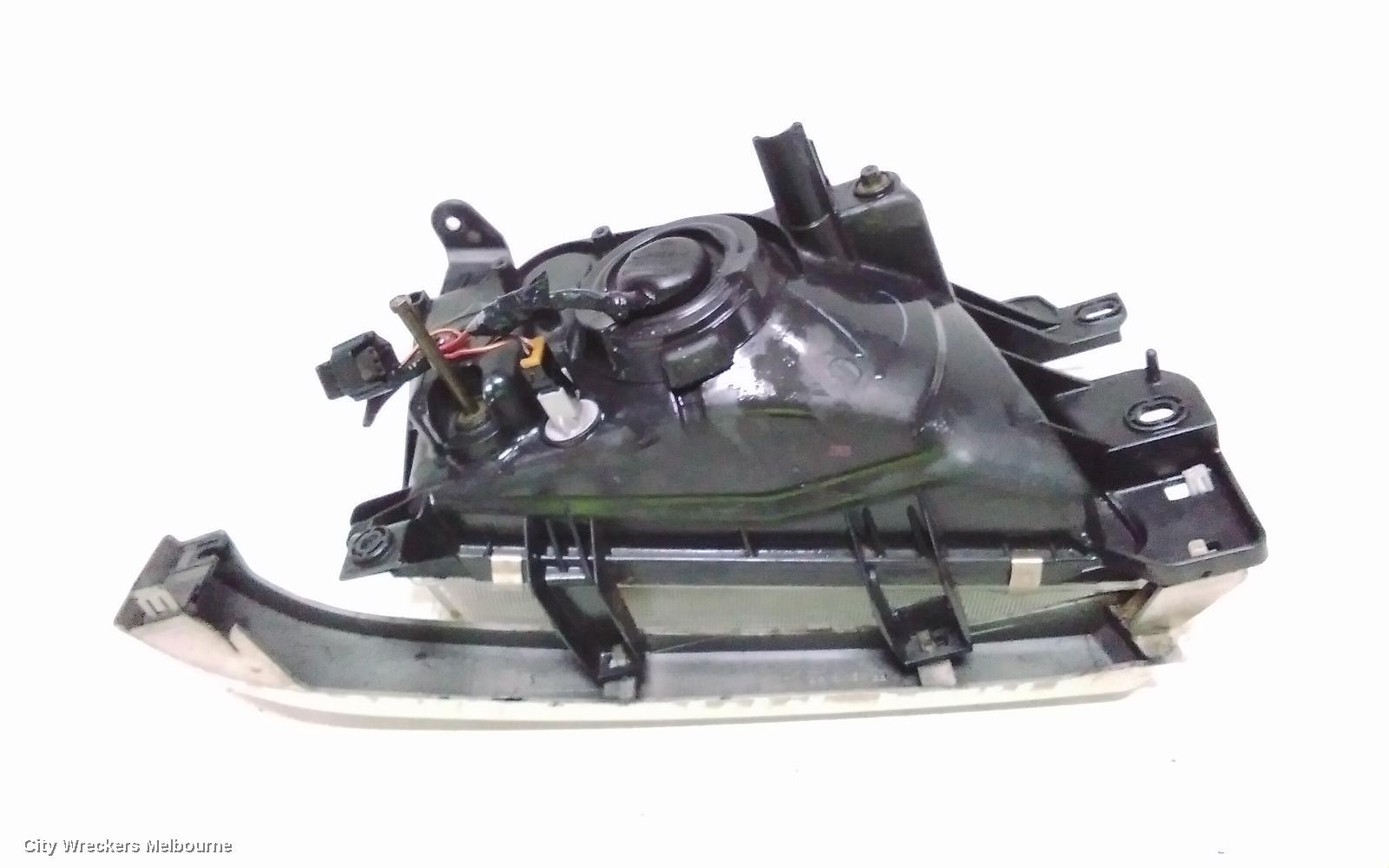 SUBARU FORESTER LEFT HEADLAMP, LENS ICHIKOH 1550, VIN JF2SF5..., 08/1997 - 01/2000
