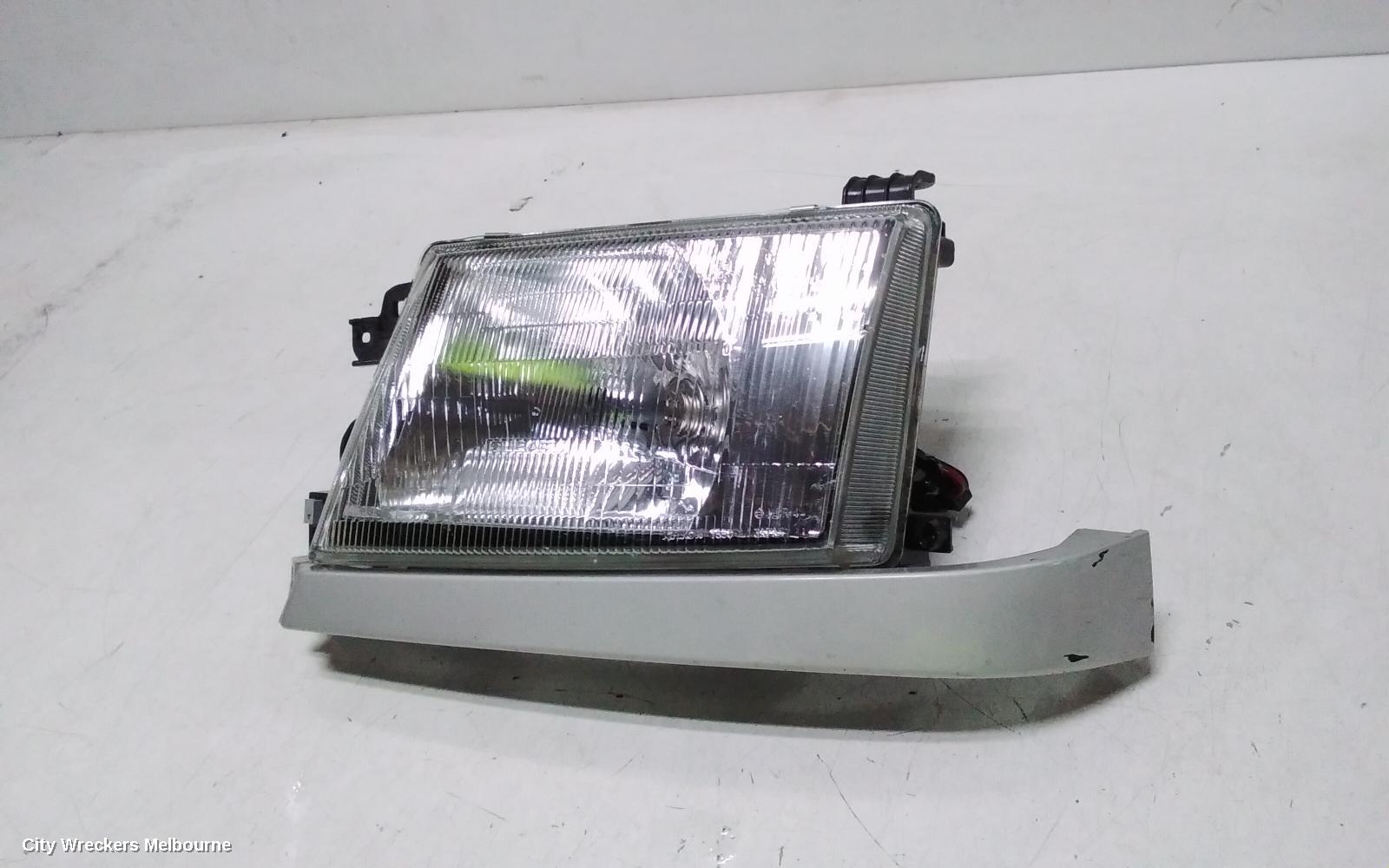 SUBARU FORESTER LEFT HEADLAMP, LENS ICHIKOH 1550, VIN JF2SF5..., 08/1997 - 01/2000