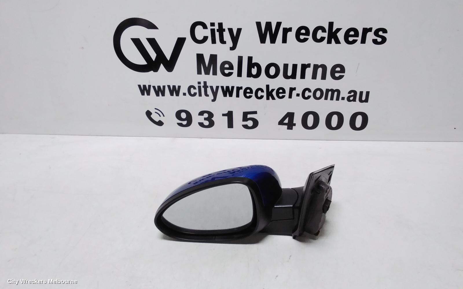 HOLDEN BARINA LEFT DOOR MIRROR, TM, COLOUR CODED, 09/2011 - 12/2018