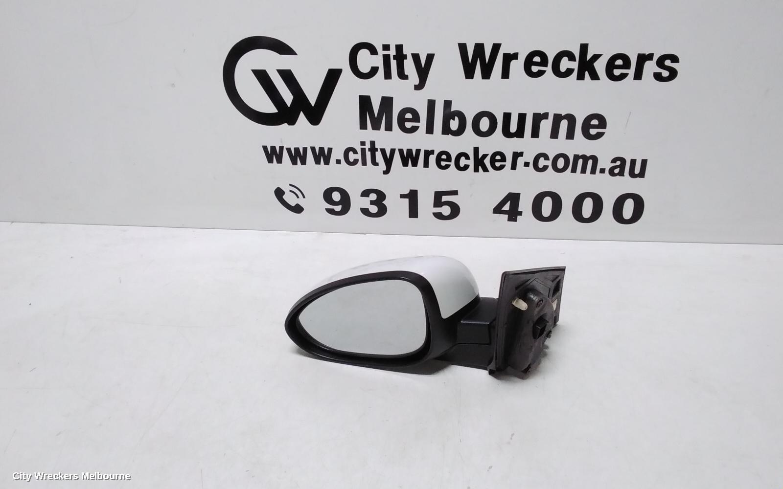 HOLDEN BARINA LEFT DOOR MIRROR, TM, COLOUR CODED, 09/2011 - 12/2018