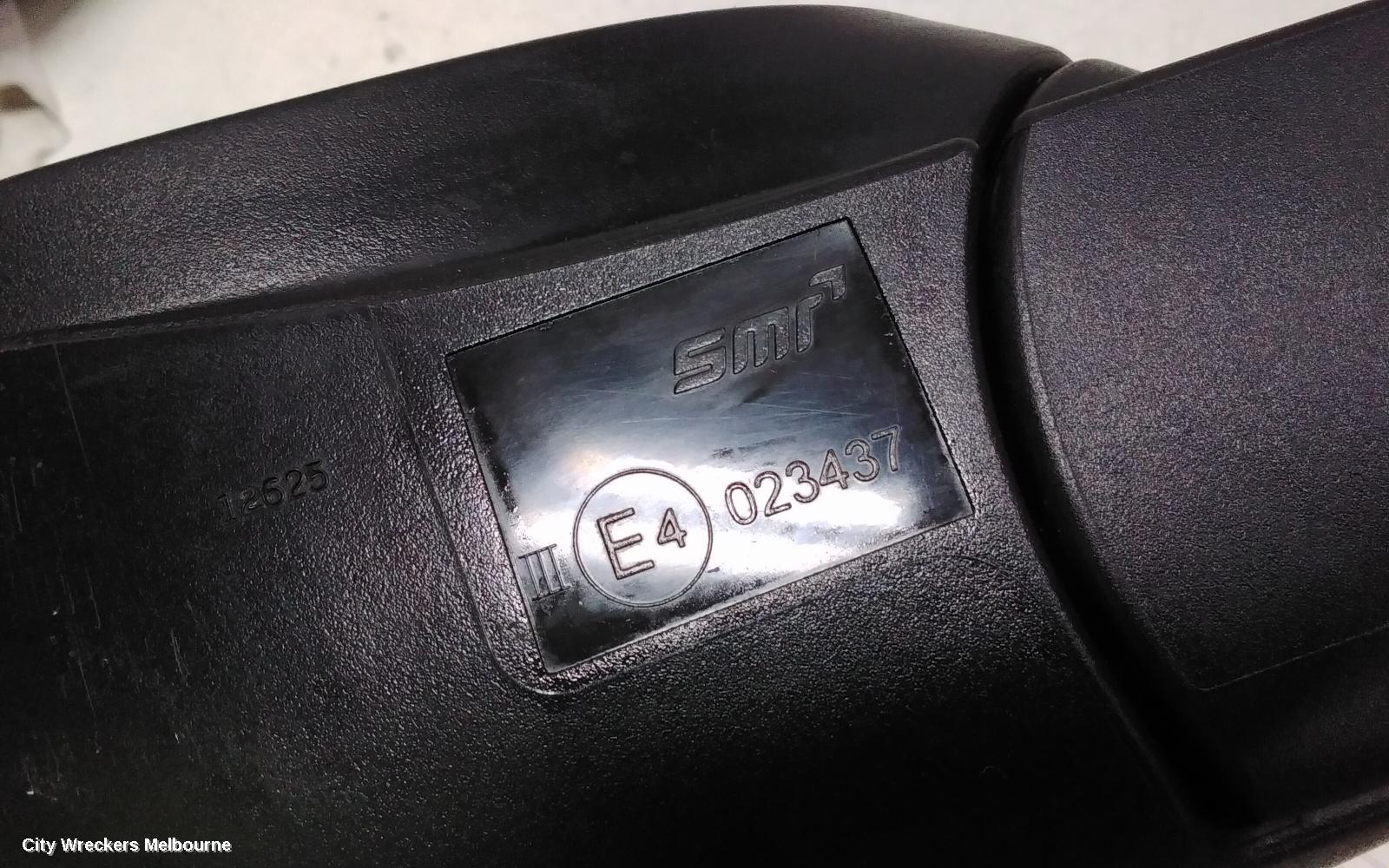 HOLDEN BARINA LEFT DOOR MIRROR, TM, COLOUR CODED, 09/2011 - 12/2018