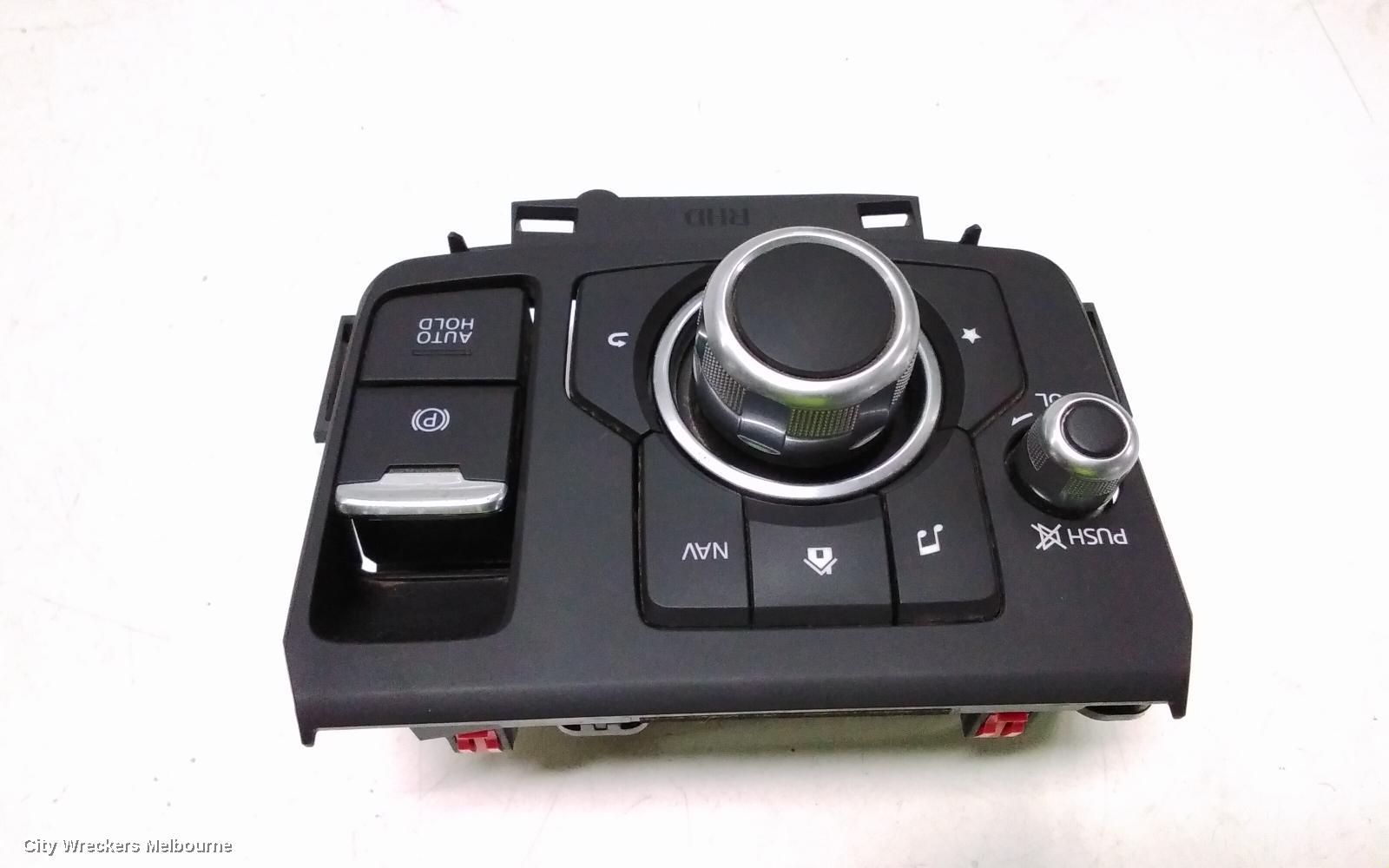 MAZDA CX3, MULTIMEDIA HUB SWITCH (CENTRE CONSOLE), W/ ELECTRIC HANDBRAKE TYPE, DK, 03/2015 ONWARDS