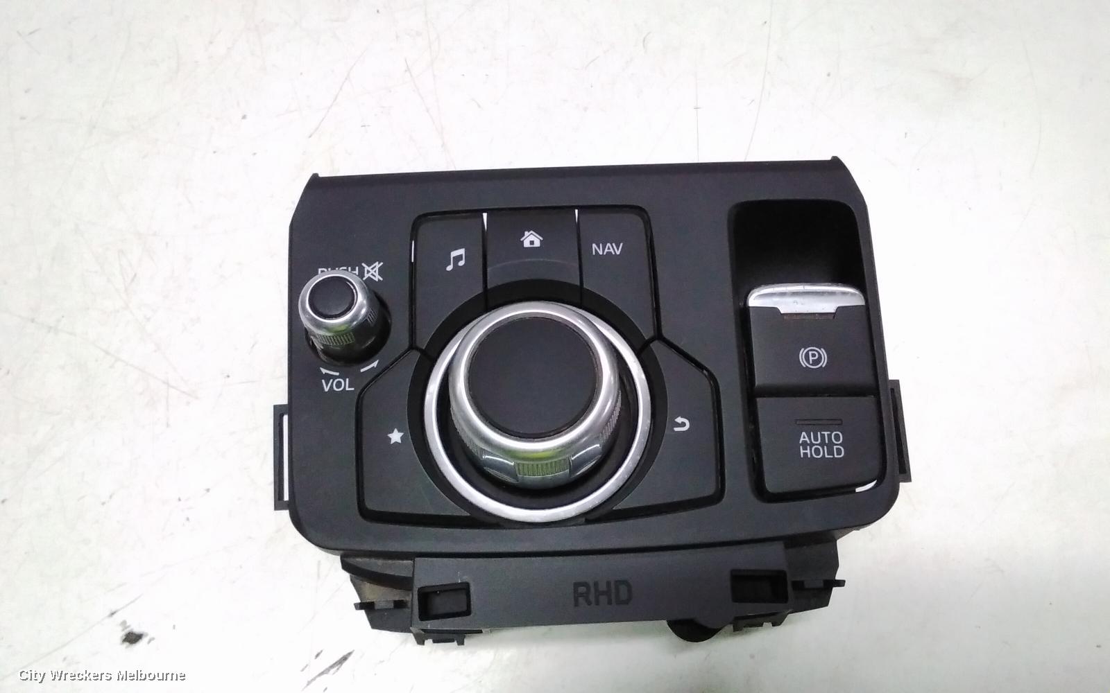 MAZDA CX3, MULTIMEDIA HUB SWITCH (CENTRE CONSOLE), W/ ELECTRIC HANDBRAKE TYPE, DK, 03/2015 ONWARDS