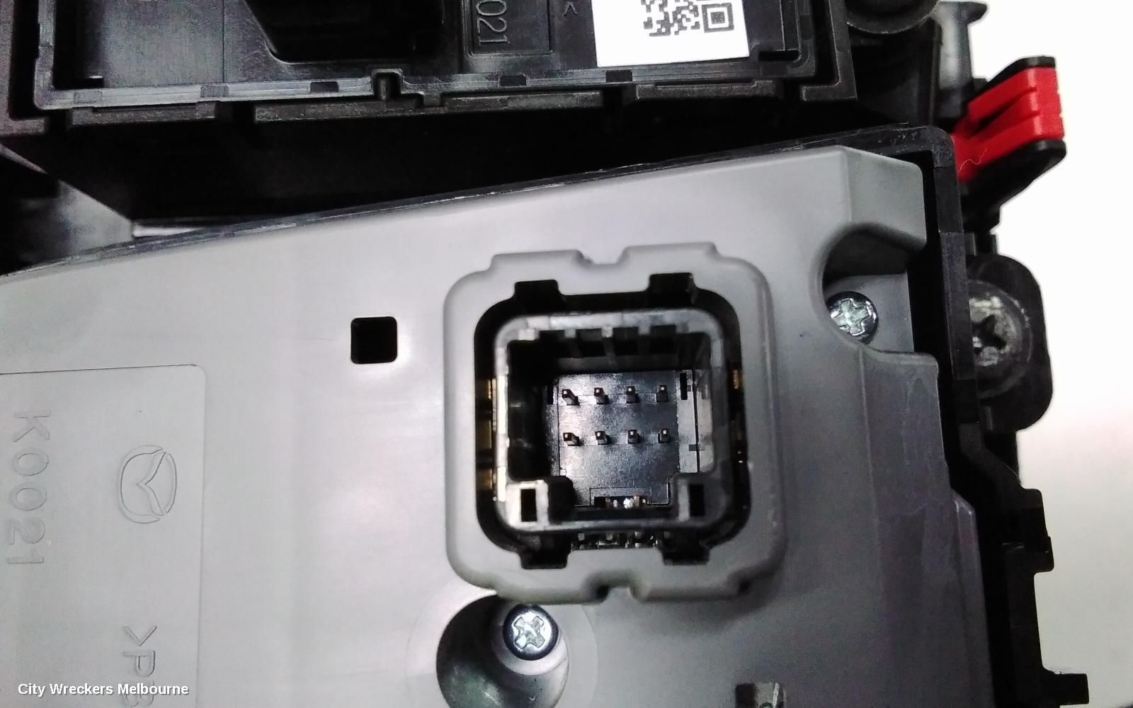 MAZDA CX3, MULTIMEDIA HUB SWITCH (CENTRE CONSOLE), W/ ELECTRIC HANDBRAKE TYPE, DK, 03/2015 ONWARDS