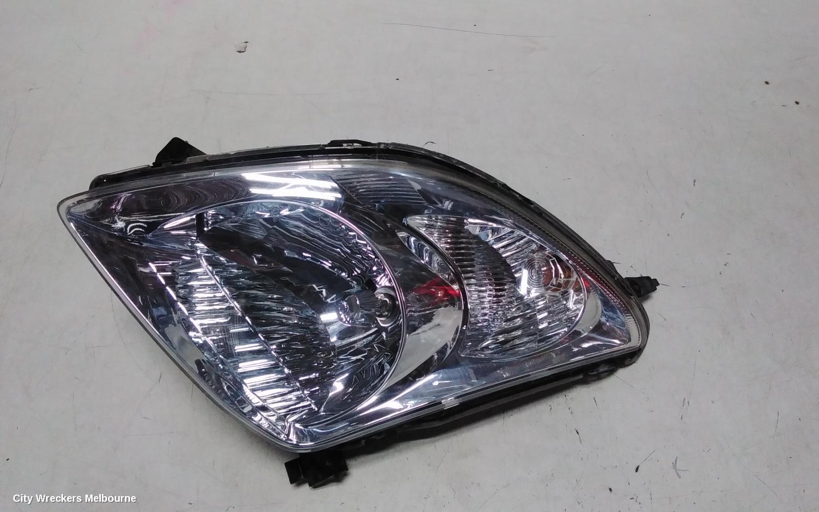 SUZUKI SWIFT LEFT HEADLAMP, RS415, MAN BEAM ADJUSTMENT, CHROME INSERT TYPE, 09/2004 - 02/2011
