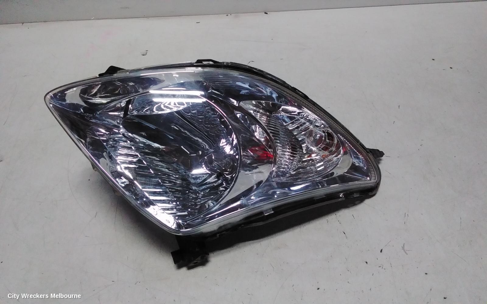 SUZUKI SWIFT LEFT HEADLAMP, RS415, MAN BEAM ADJUSTMENT, CHROME INSERT TYPE, 09/2004 - 02/2011