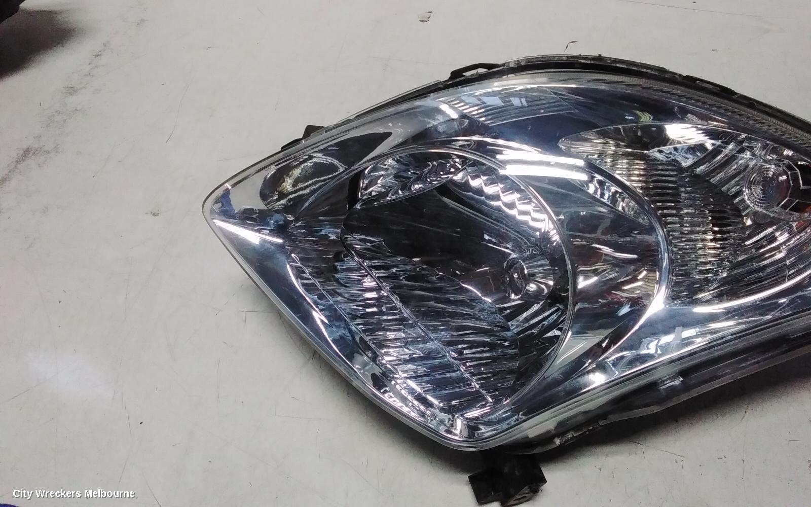 SUZUKI SWIFT LEFT HEADLAMP, RS415, MAN BEAM ADJUSTMENT, CHROME INSERT TYPE, 09/2004 - 02/2011