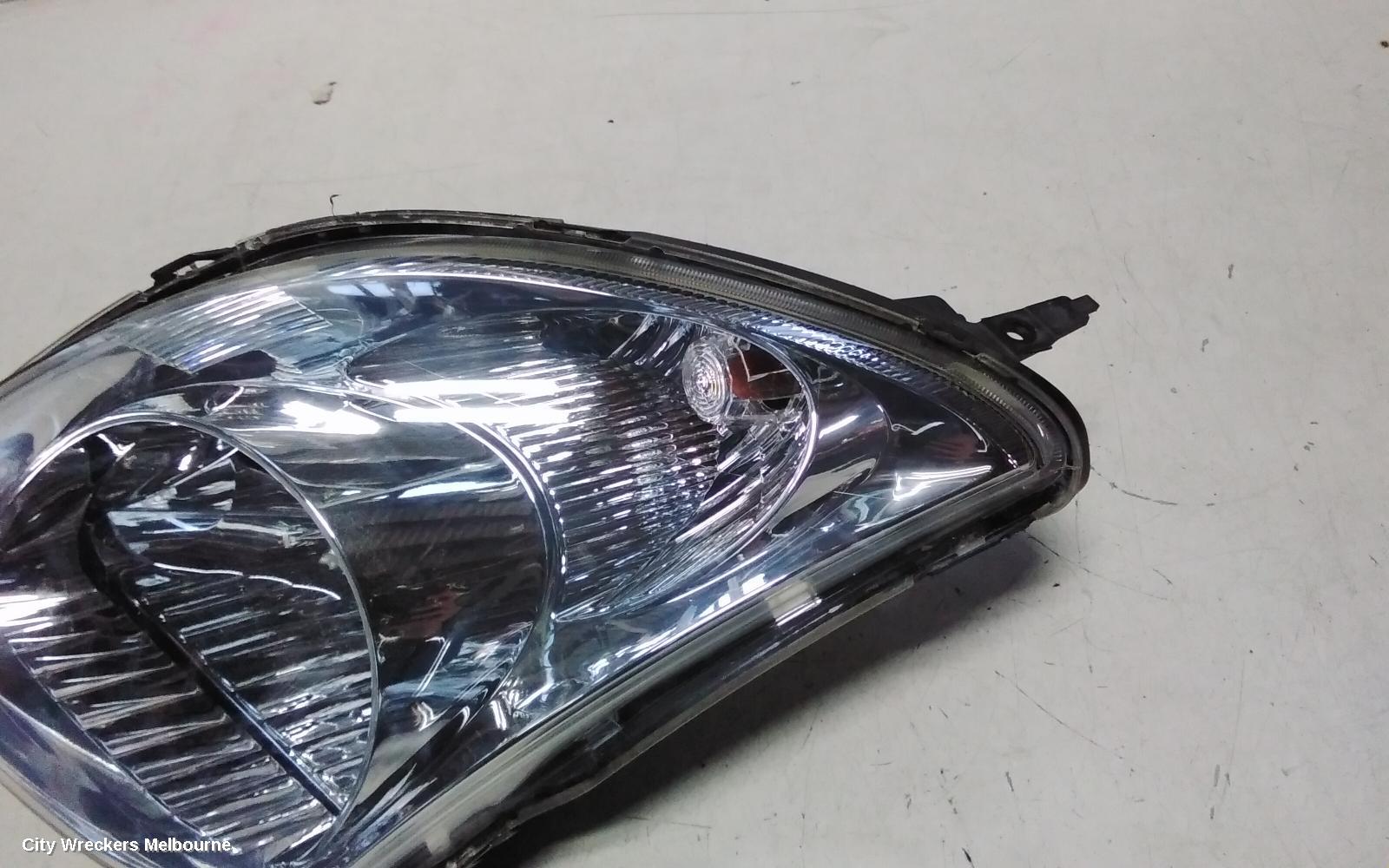 SUZUKI SWIFT LEFT HEADLAMP, RS415, MAN BEAM ADJUSTMENT, CHROME INSERT TYPE, 09/2004 - 02/2011