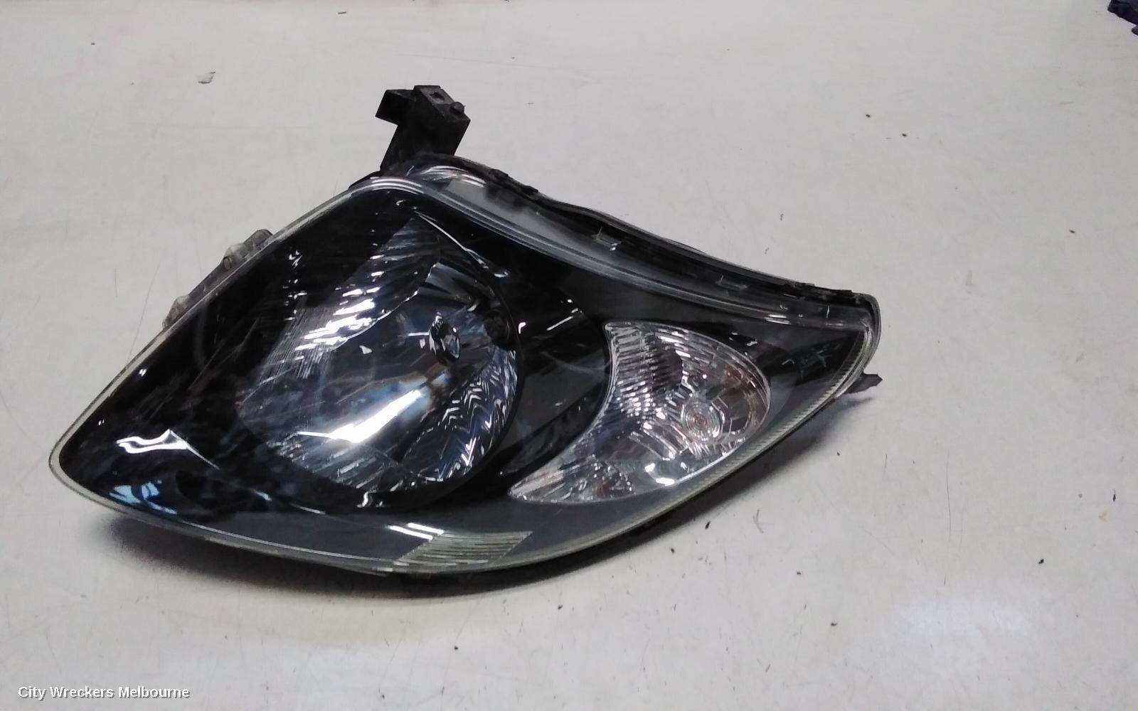 SUZUKI SWIFT RIGHT HEADLAMP, RS415, MAN BEAM ADJUSTMENT, BLACK INSERT TYPE, 09/2004 - 02/2011