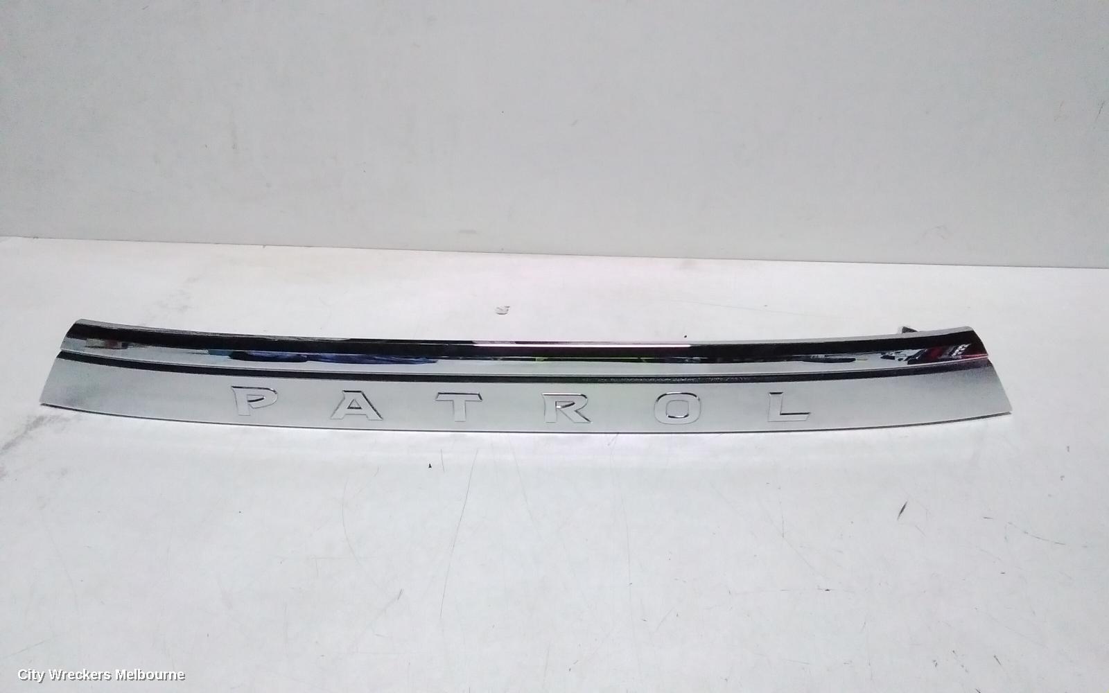 NISSAN PATROL REAR GARNISH, Y62, TAILGATE GARNISH (CENTRE), 10/2019 ONWARDS