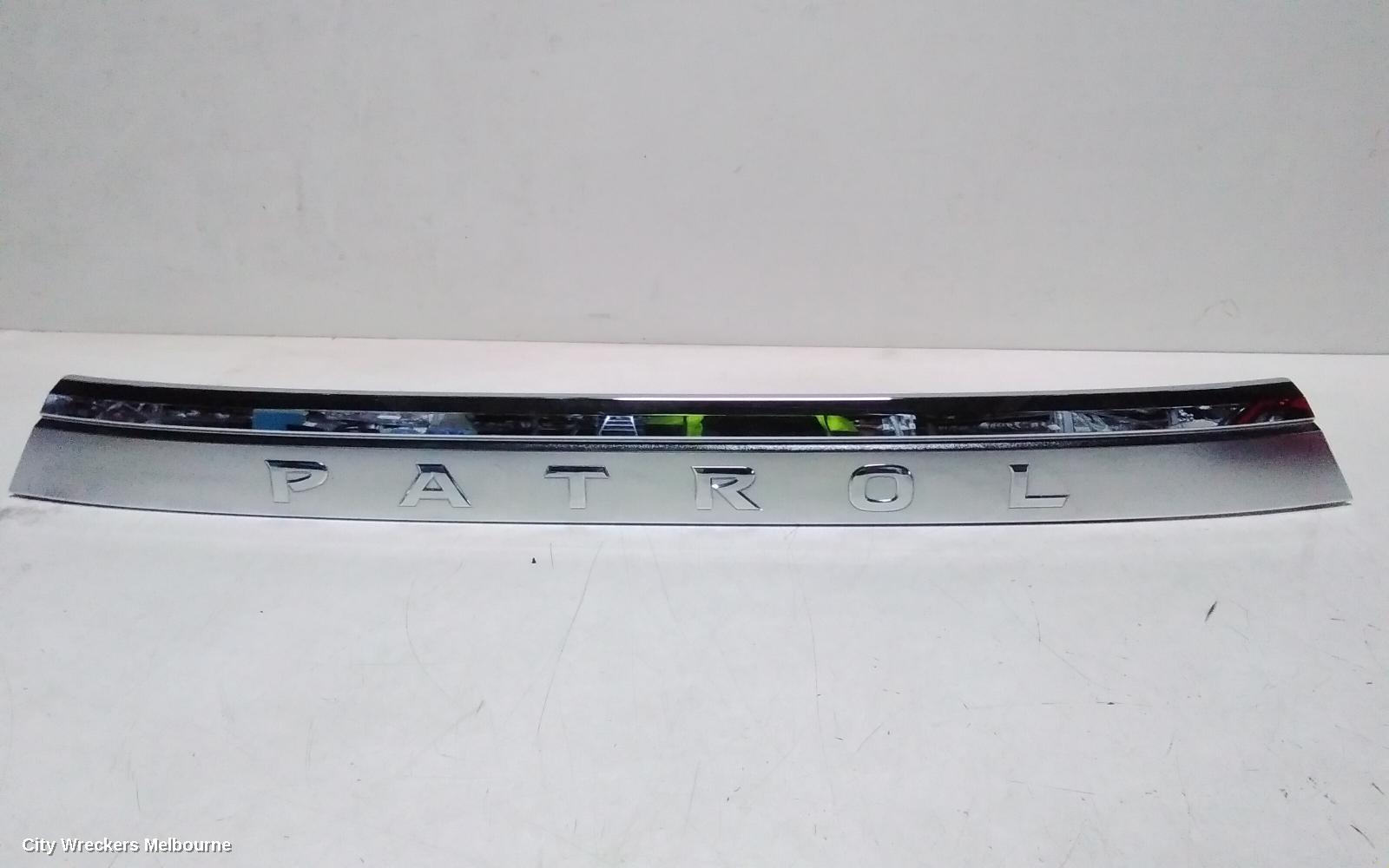 NISSAN PATROL REAR GARNISH, Y62, TAILGATE GARNISH (CENTRE), 10/2019 ONWARDS