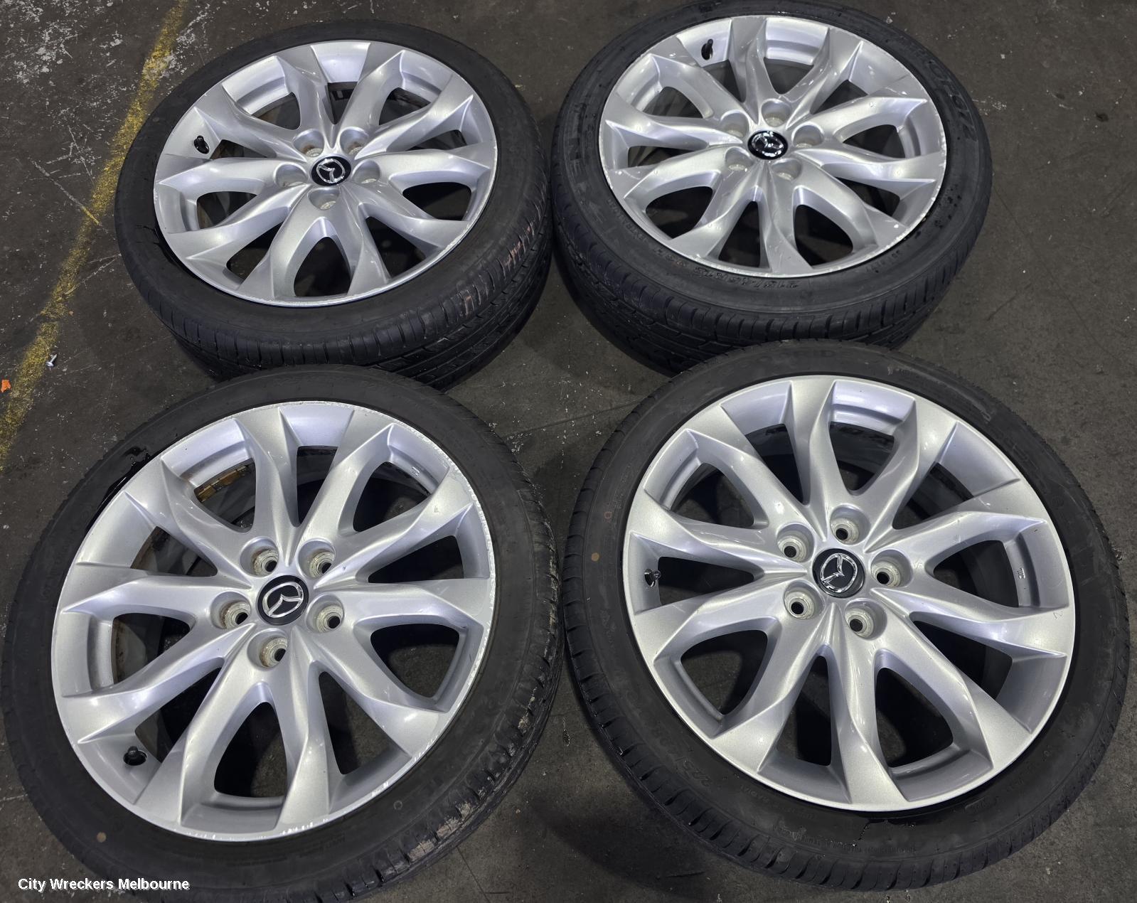 MAZDA 3 WHEEL MAG, FACTORY, 18X7IN, LIGHT GREY, BN, 05/2016 - 02/2019