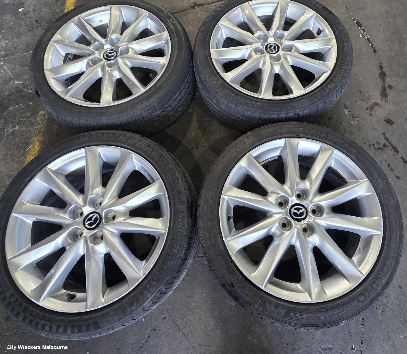 MAZDA 3 WHEEL MAG, FACTORY, 18X7IN, LIGHT GREY, BN, 05/2016 - 02/2019
