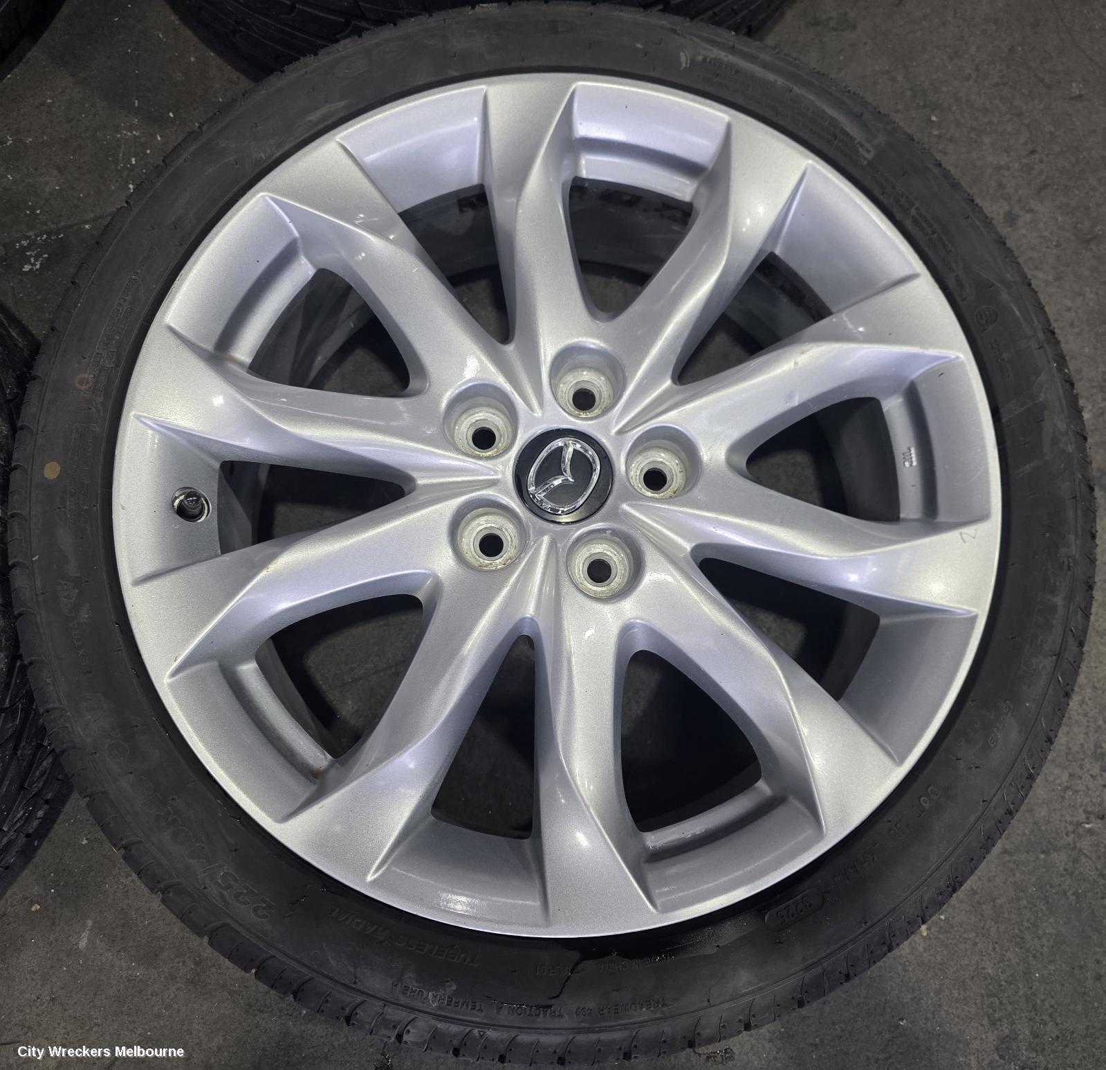 MAZDA 3 WHEEL MAG, FACTORY, 18X7IN, LIGHT GREY, BN, 05/2016 - 02/2019