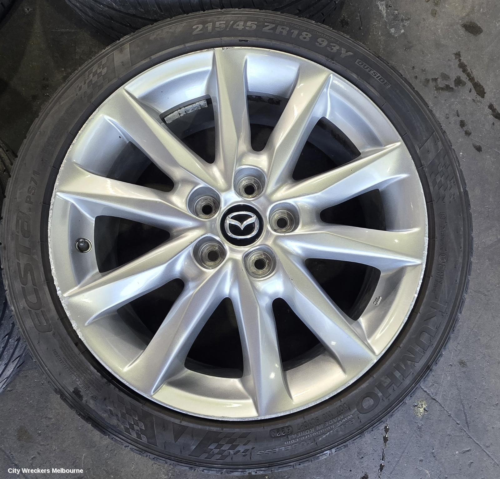 MAZDA 3 WHEEL MAG, FACTORY, 18X7IN, LIGHT GREY, BN, 05/2016 - 02/2019