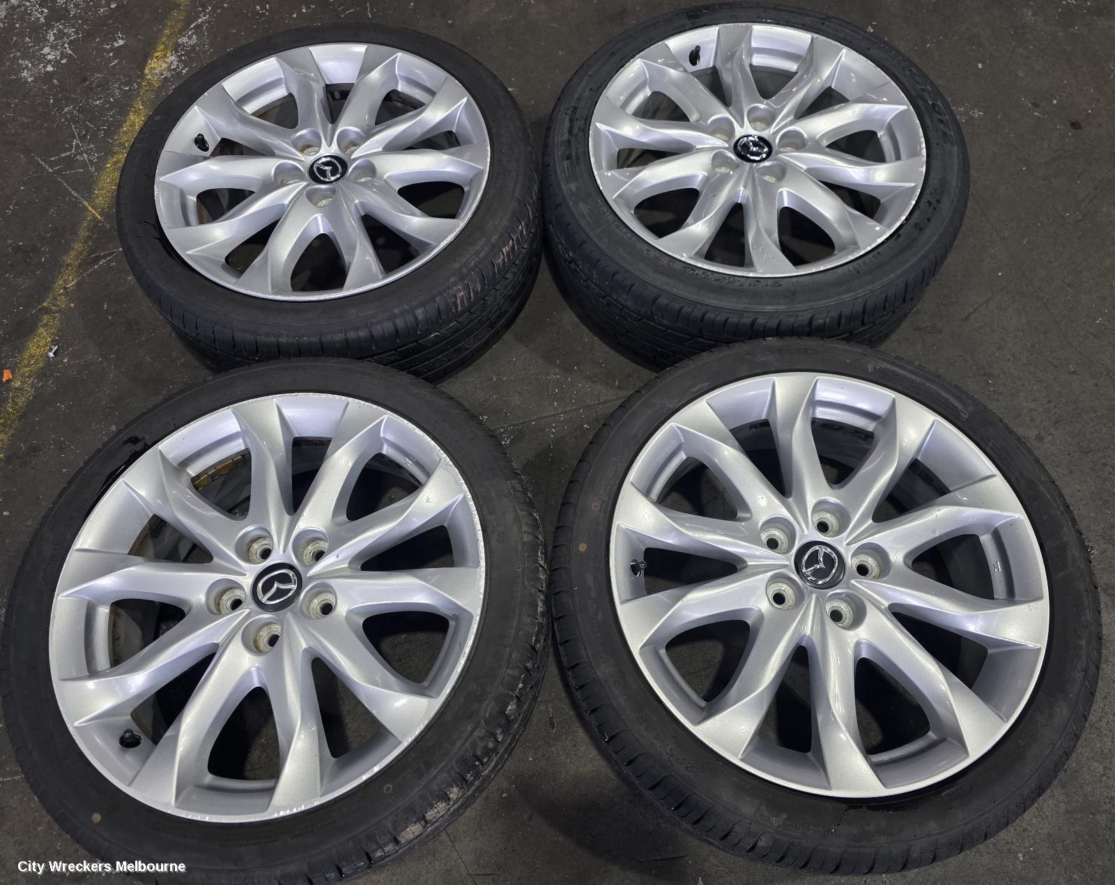 MAZDA 3 WHEEL MAG, FACTORY, 18X7IN, LIGHT GREY, BN, 05/2016 - 02/2019
