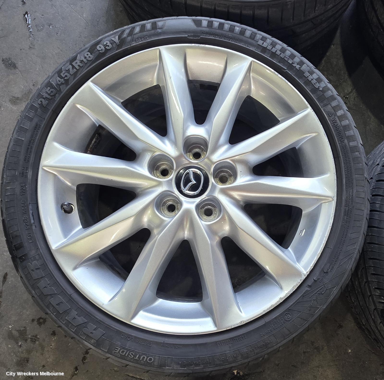 MAZDA 3 WHEEL MAG, FACTORY, 18X7IN, LIGHT GREY, BN, 05/2016 - 02/2019