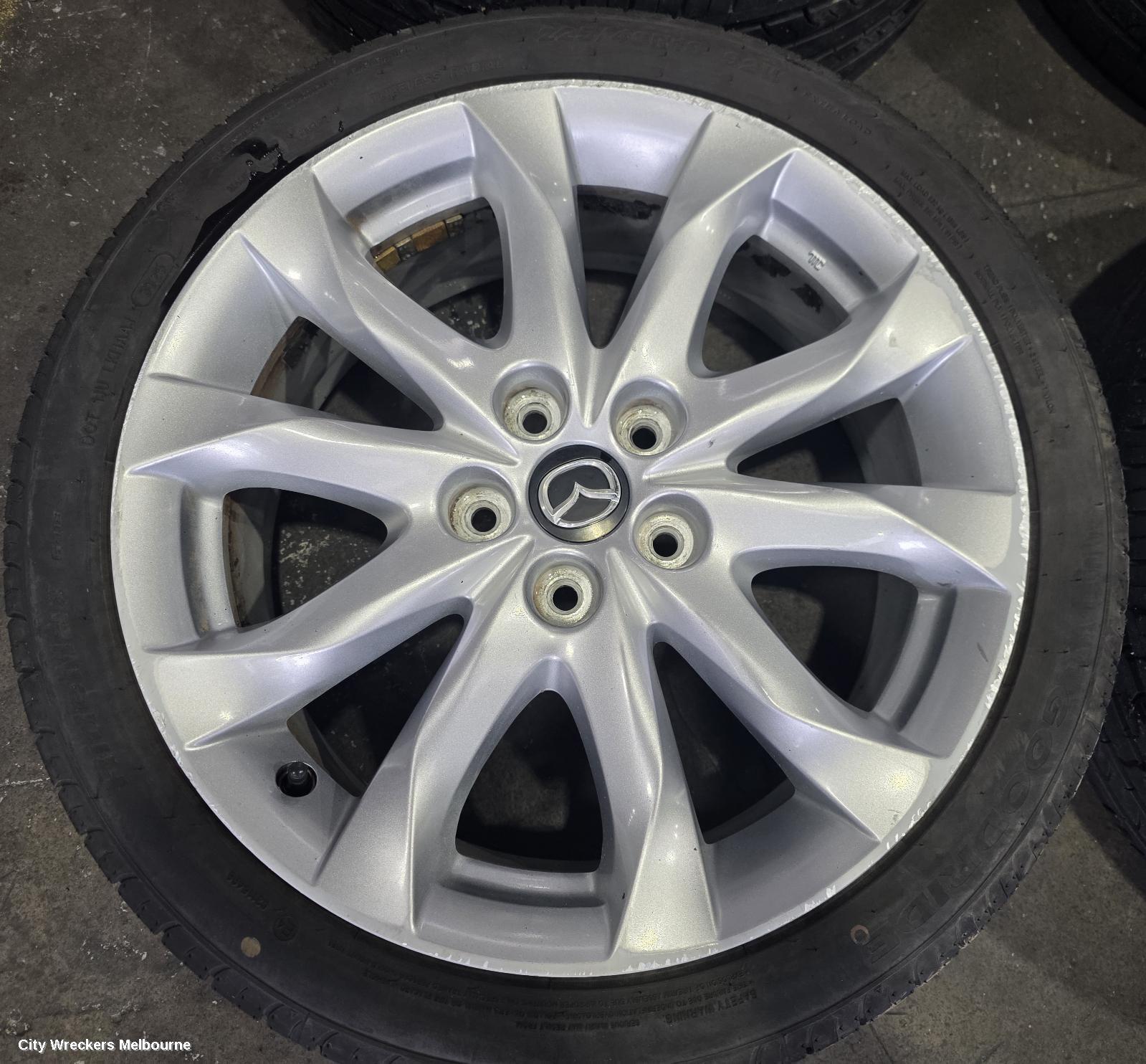 MAZDA 3 WHEEL MAG, FACTORY, 18X7IN, LIGHT GREY, BN, 05/2016 - 02/2019