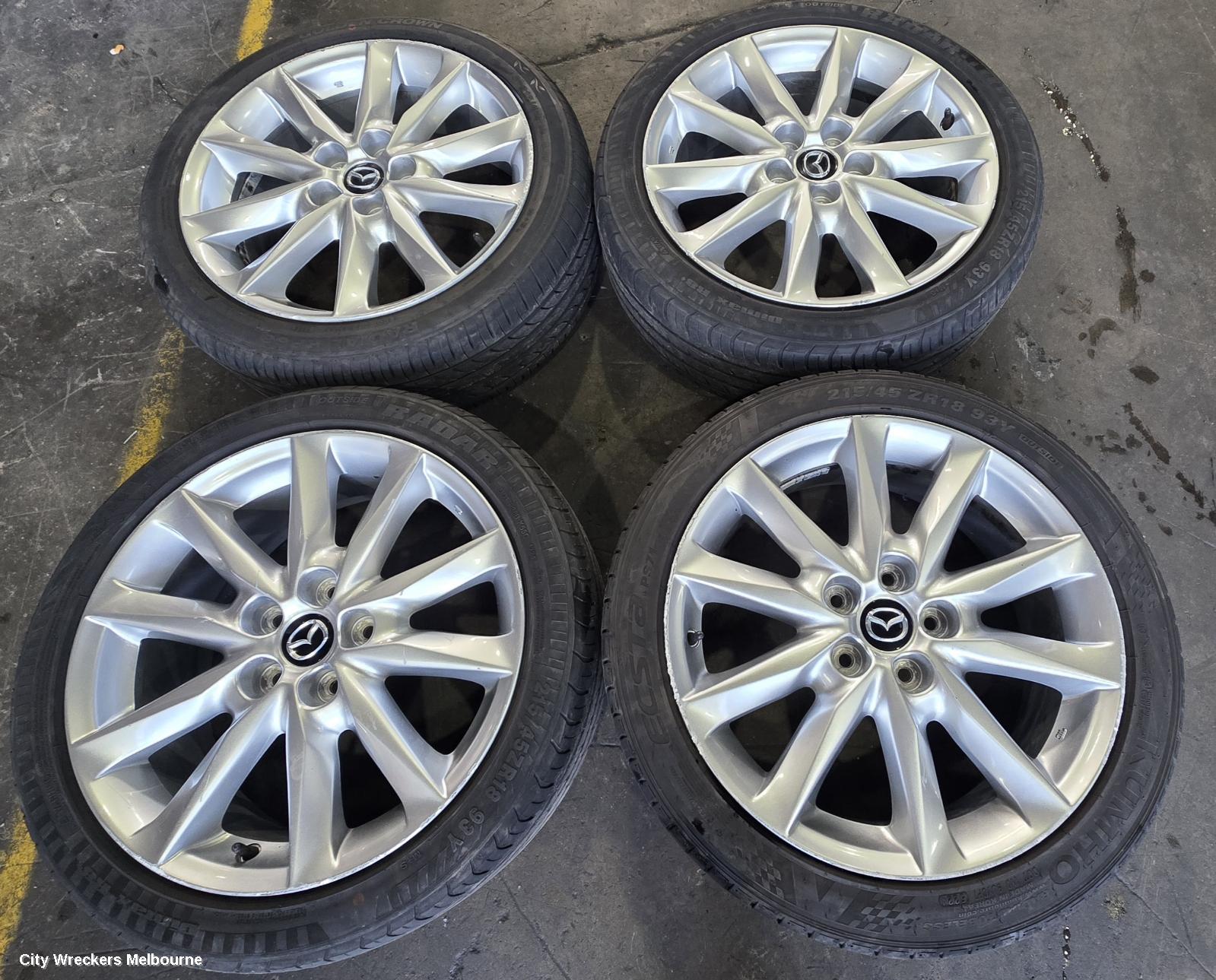 MAZDA 3 WHEEL MAG, FACTORY, 18X7IN, LIGHT GREY, BN, 05/2016 - 02/2019