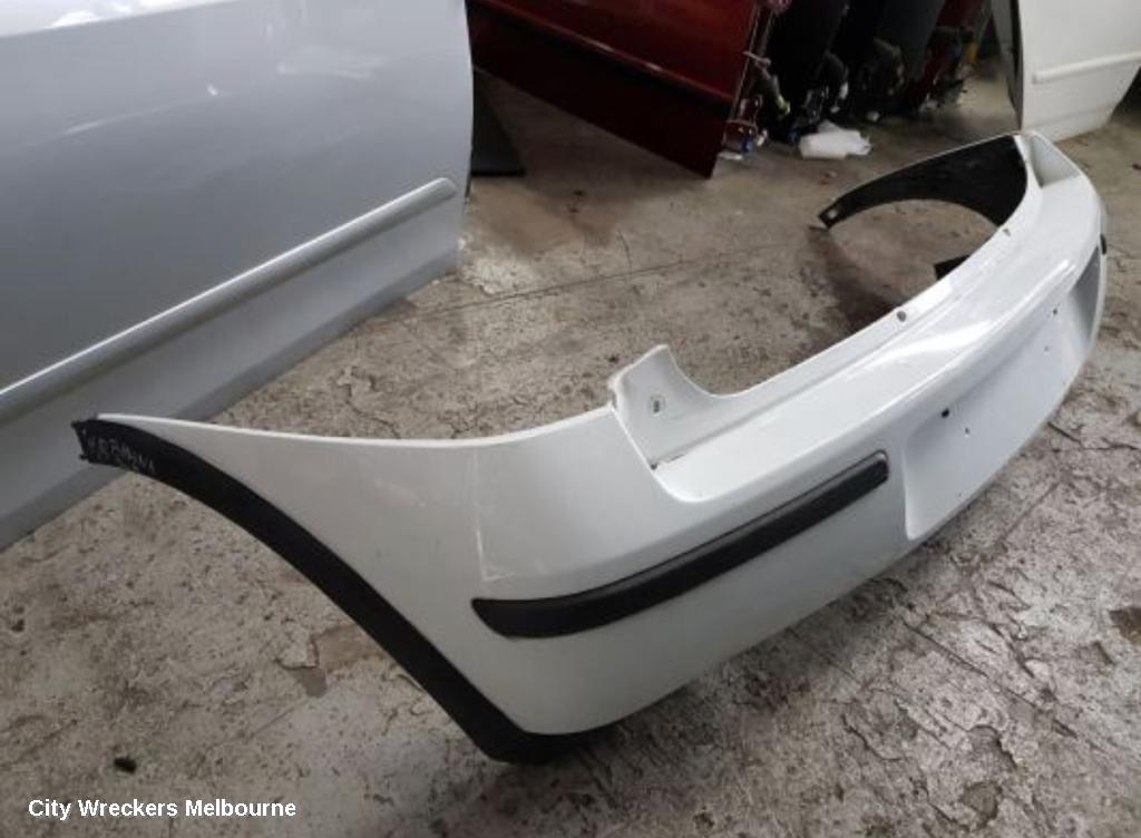 HOLDEN BARINA REAR BUMPER, BUMPER BAR, HATCH, LAST 8 DIGITS OF VIN IS FROM  44000001-, (REFLECTORS ON BOTTOM), XC, 03/2001 - 11/2005