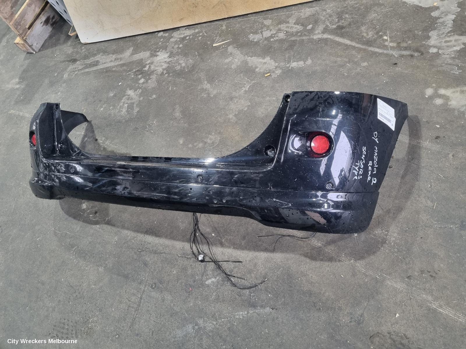 MAZDA 2 REAR BUMPER, DY2 SERIES, SPOILERED TYPE, 06/2005 - 09/2007