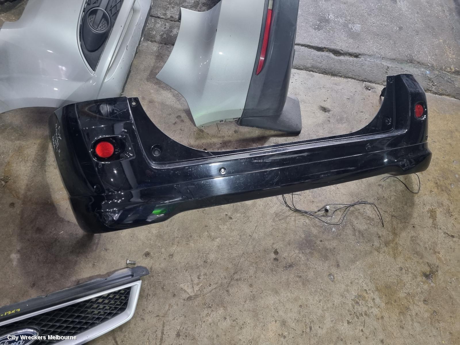 MAZDA 2 REAR BUMPER, DY2 SERIES, SPOILERED TYPE, 06/2005 - 09/2007