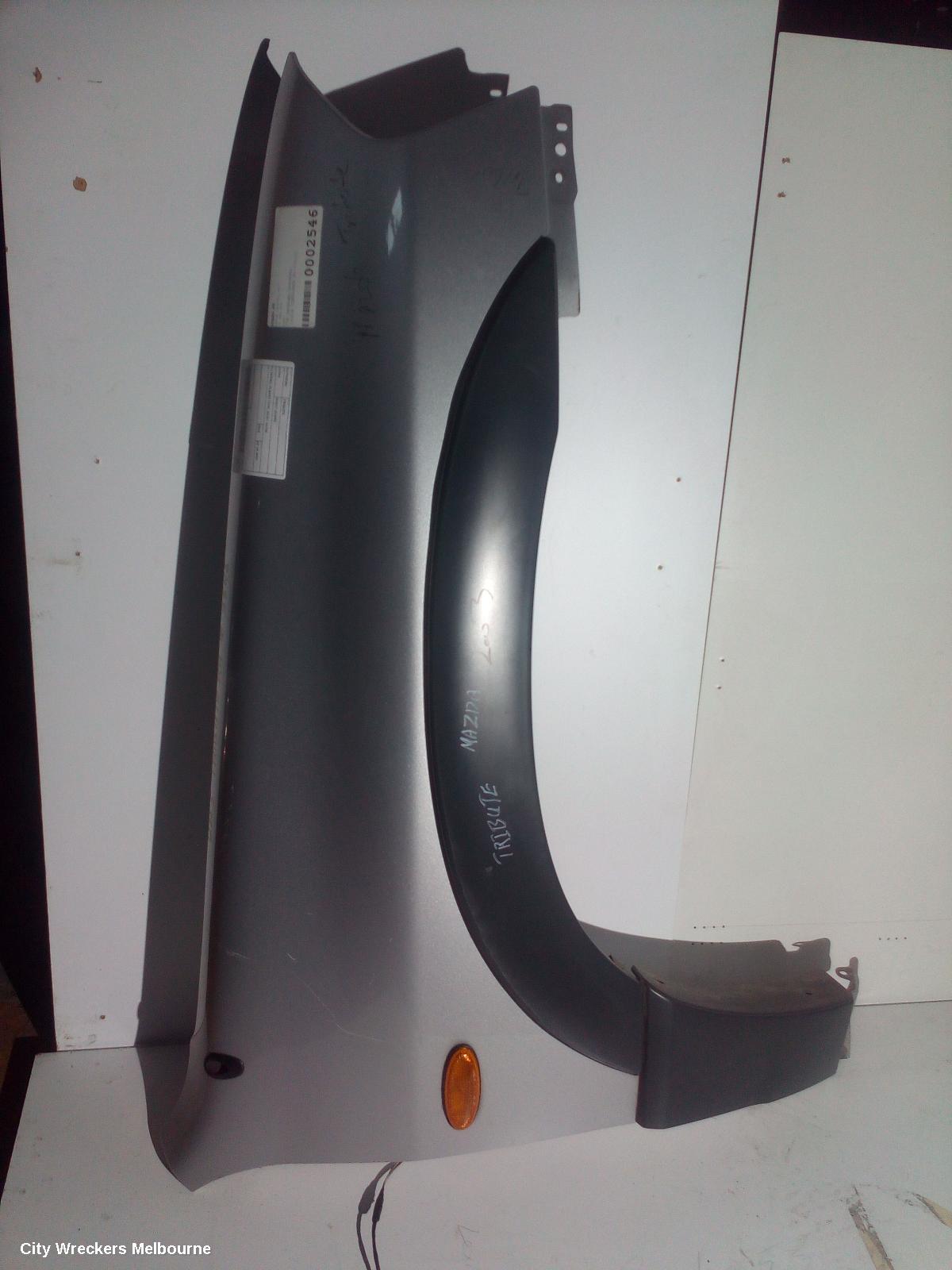 MAZDA TRIBUTE RIGHT GUARD, YU SERIES, FLARED TYPE, 02/2001 - 06/2006