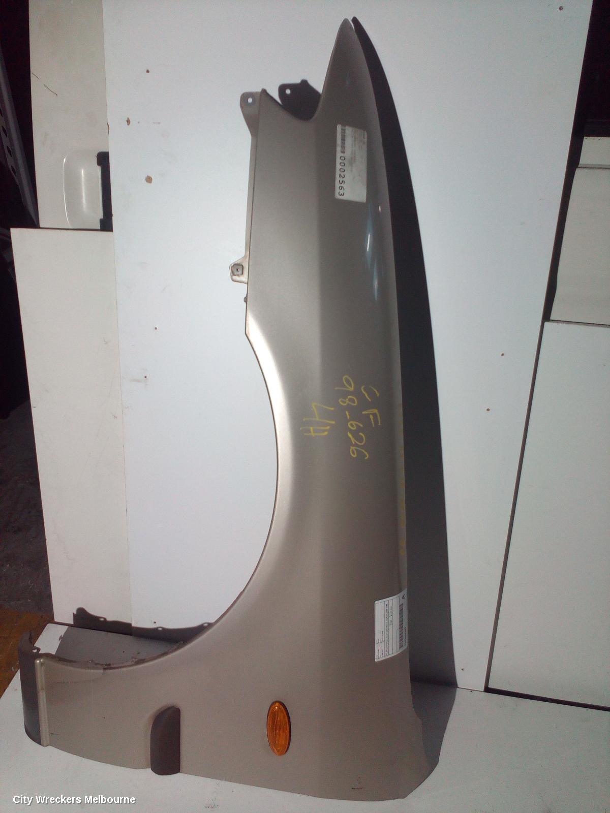 MAZDA 626 LEFT GUARD, GF, SEDAN/HATCH, GLUED ON MOULD, W/ REPEATER TYPE, 08/1997 - 11/1999