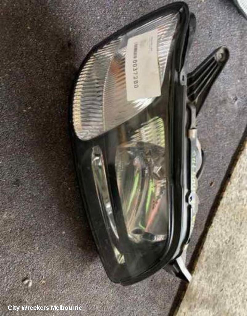 SUBARU LIBERTY LEFT HEADLAMP, 3RD GEN, BLACK INSERT, 11/1998 - 06/2001