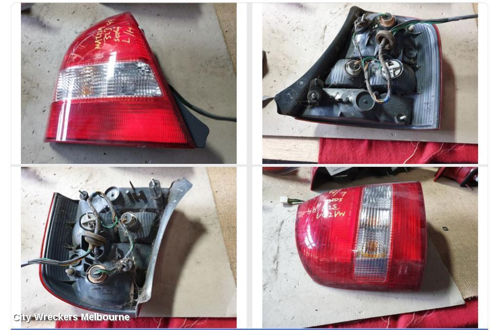 MAZDA 323 LEFT TAILLIGHT, BJ, SEDAN, CLEAR TYPE, KOITO LENS# 220-61866, 09/1998 - 05/2002