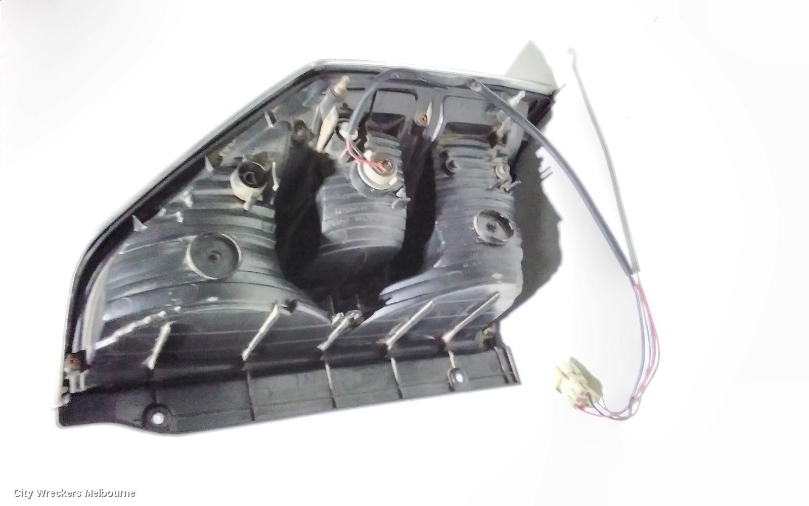 MITSUBISHI PAJERO LEFT TAILLIGHT, NM, IN BODY, CHROME SURROUND TYPE, 05/2000 - 10/2002