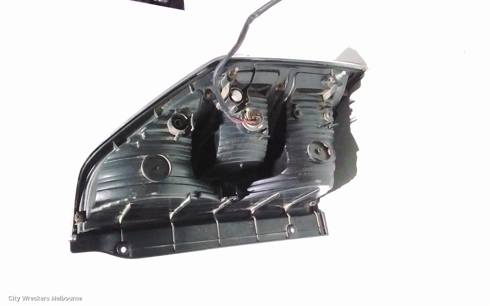 MITSUBISHI PAJERO LEFT TAILLIGHT, NM, IN BODY, CHROME SURROUND TYPE, 05/2000 - 10/2002