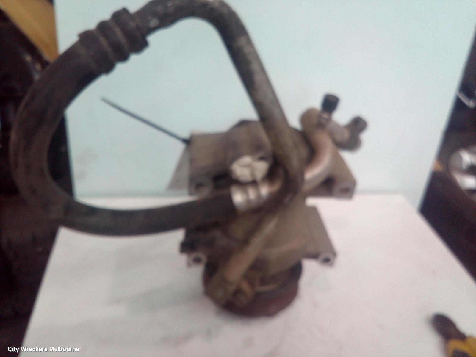 NISSAN NAVARA A/C COMPRESSOR, D40, 2.5, YD25, DIESEL, P/N 92600EB70A, 09/2005 - 08/2015