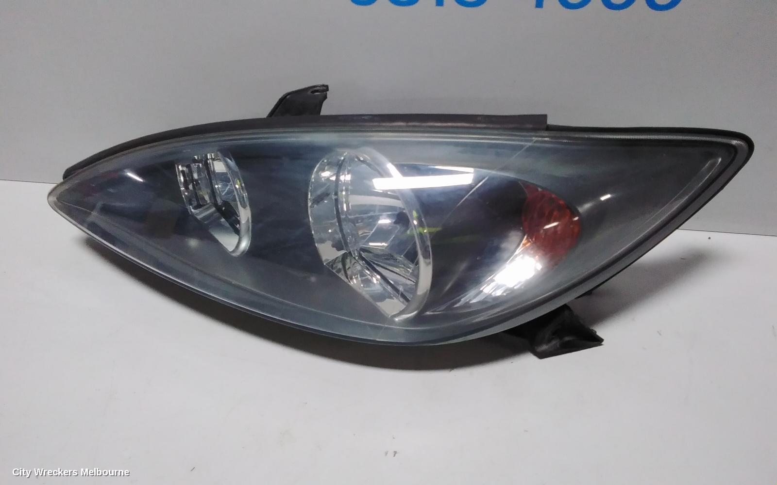 TOYOTA CAMRY LEFT HEADLAMP, SK36, SPORTIVO, BLACK INSERT TYPE, 08/2002 - 09/2004
