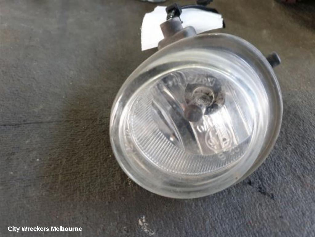 MAZDA 3 RIGHT INDICATOR/FOG/SIDE, BUMPER FOGLAMP, BK, ROUND TYPE, LENS# 114-61009, 10/2003 - 04/2009