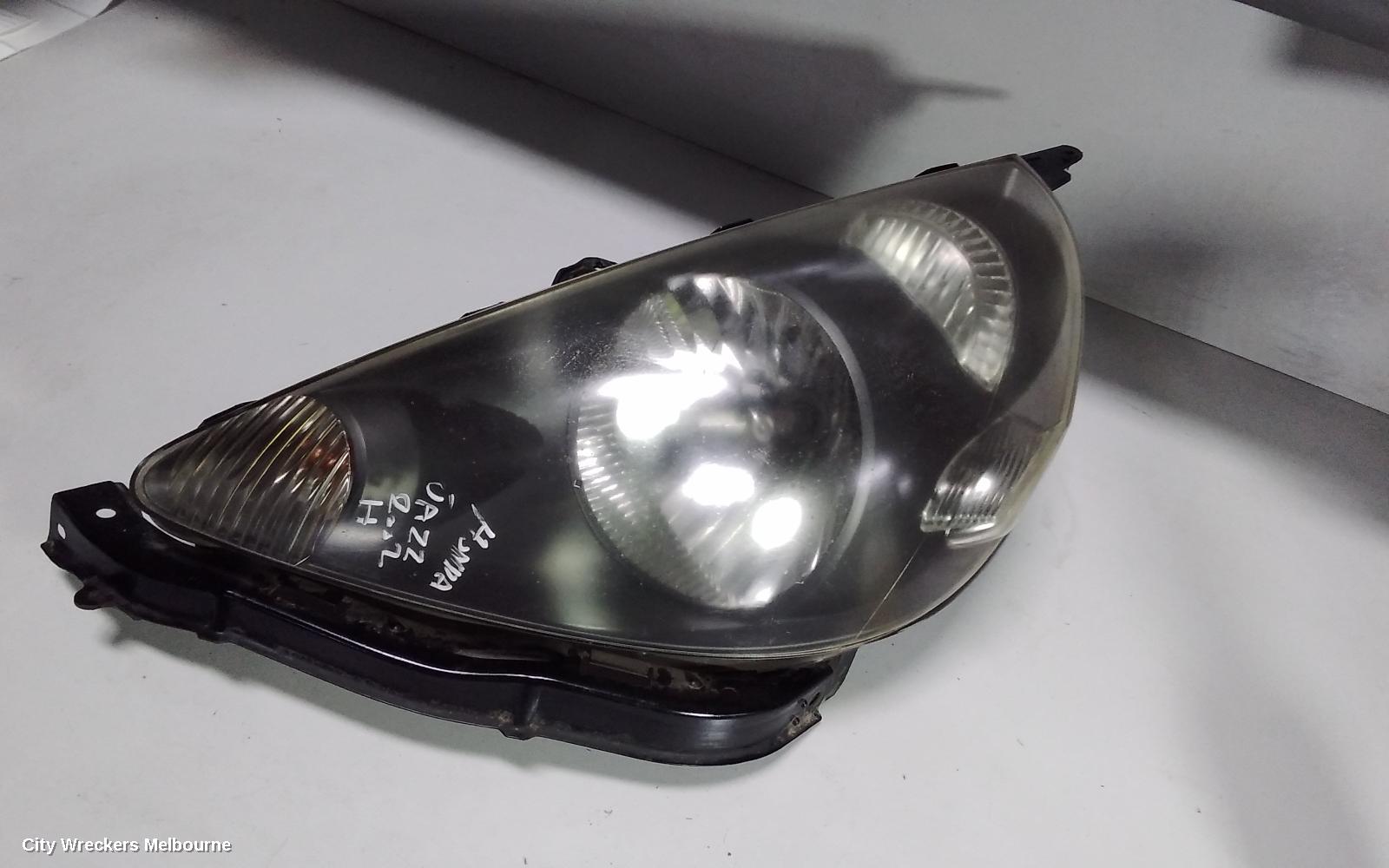 HONDA JAZZ LEFT HEADLAMP, GD, BLACK INSERT TYPE, LENS# P1680, 10/2002 - 09/2004