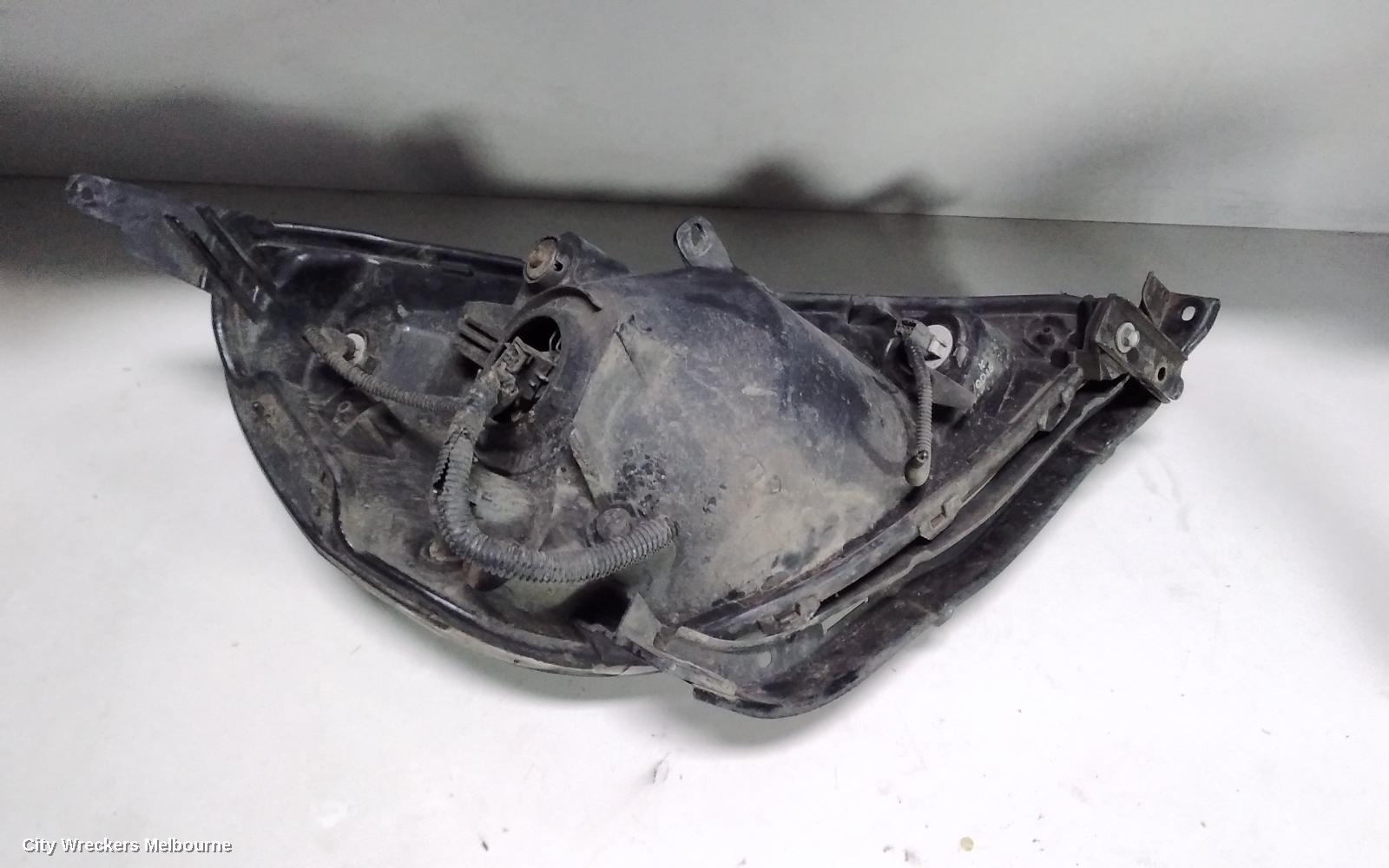 HONDA JAZZ LEFT HEADLAMP, GD, BLACK INSERT TYPE, LENS# P1680, 10/2002 - 09/2004