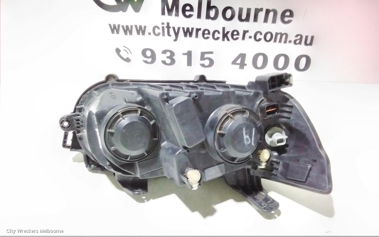 HOLDEN BARINA LEFT HEADLAMP, TM, W/ CHROME RING TYPE, 11/2011 - 08/2016