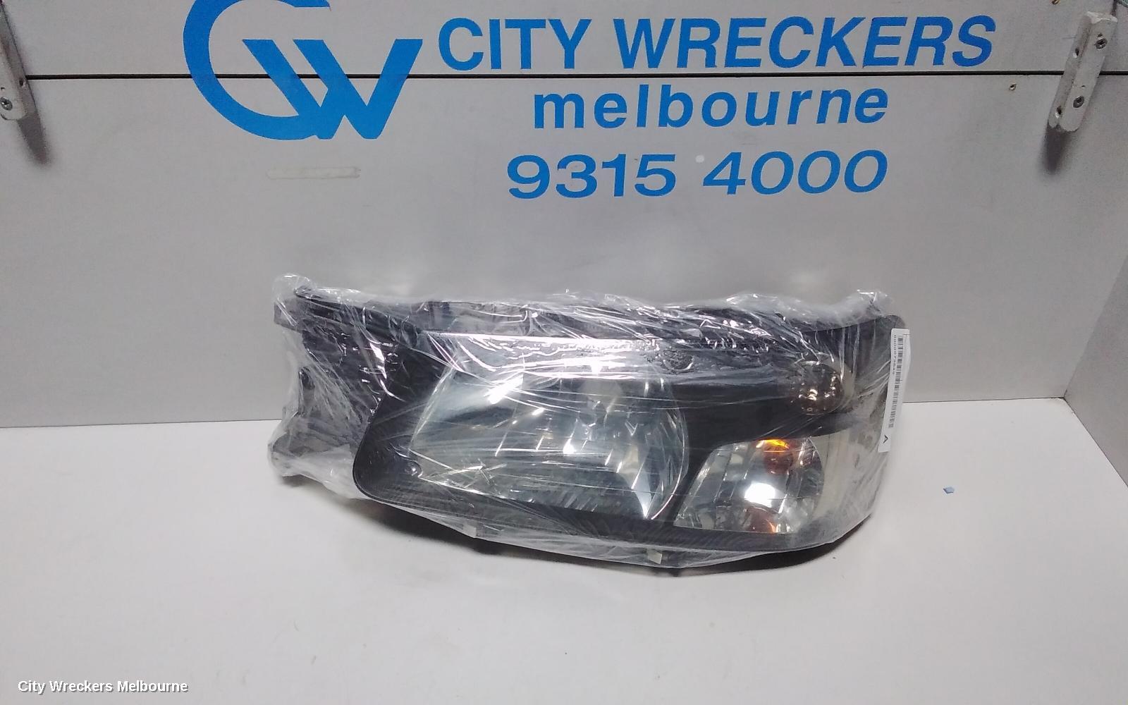 SUBARU FORESTER LEFT HEADLAMP, BLACK INSERT (CURVED LINES), LENS# 1700, 08/2004 - 05/2005
