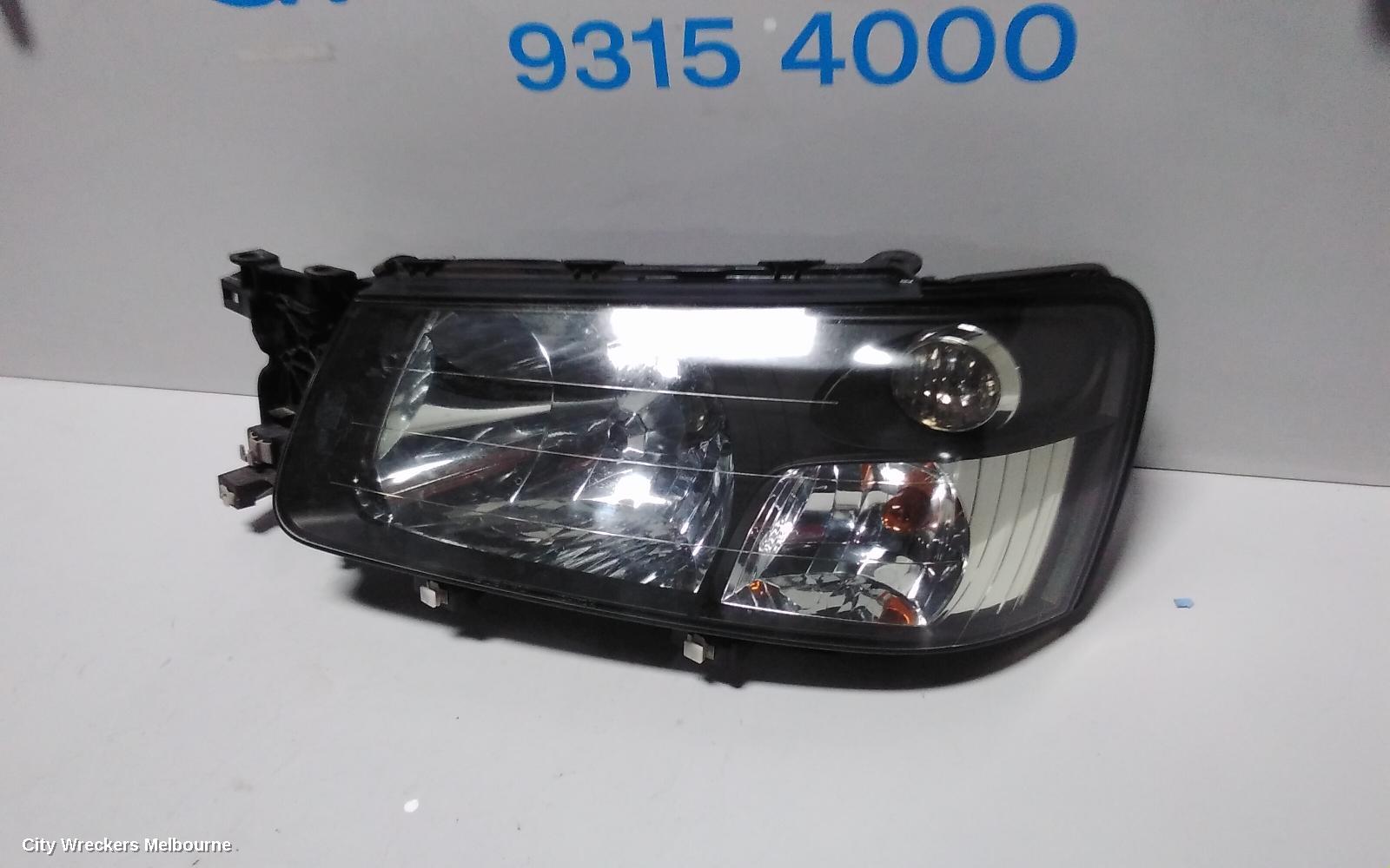 SUBARU FORESTER LEFT HEADLAMP, BLACK INSERT (CURVED LINES), LENS# 1700, 08/2004 - 05/2005