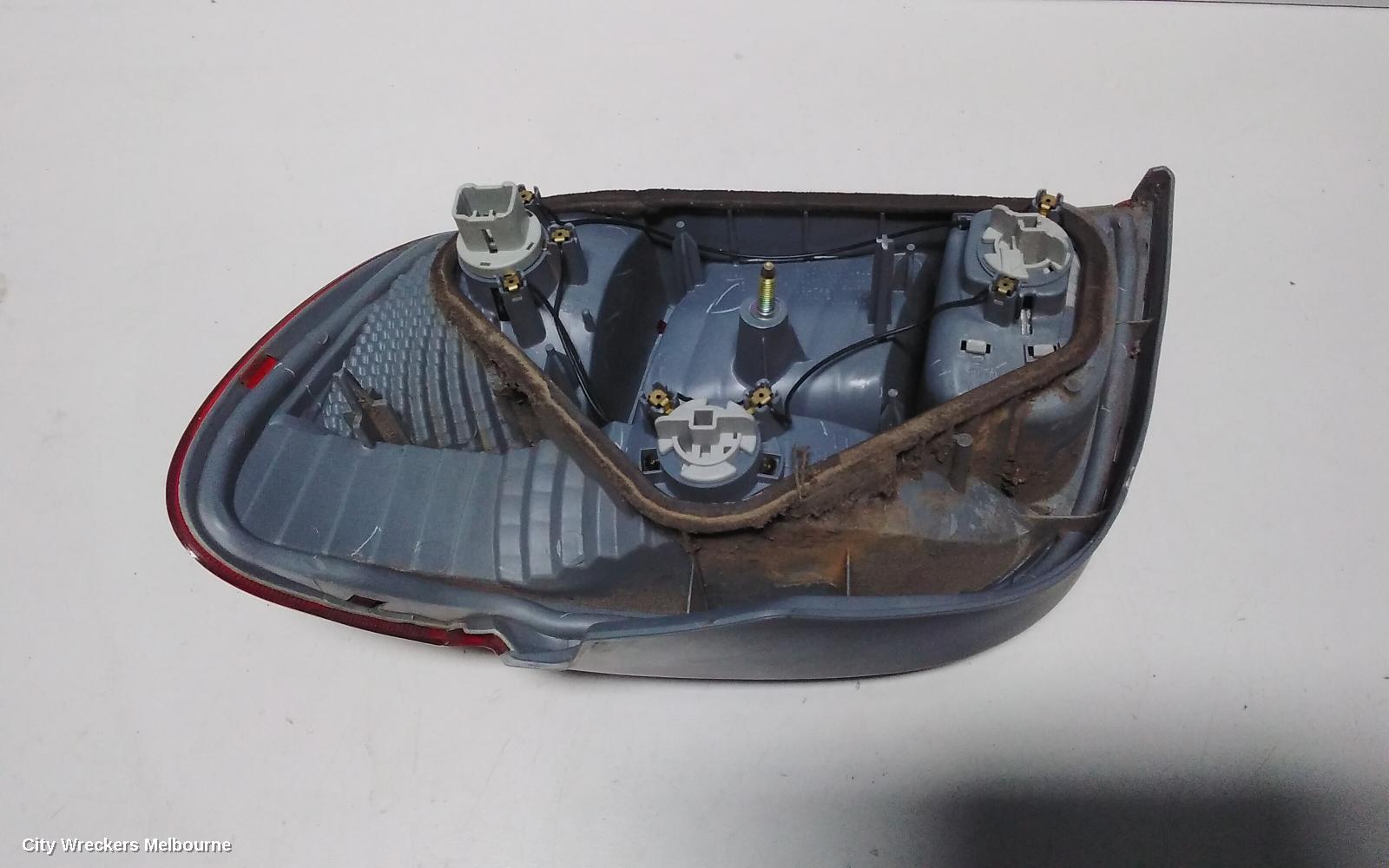 TOYOTA ECHO LEFT TAILLIGHT, NCP10R, HATCH, LENS# 52-049, 10/2002 - 09/2005