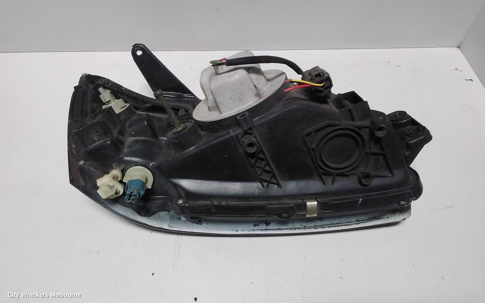 SUBARU LIBERTY LEFT HEADLAMP, 3RD GEN, BLACK INSERT, 11/1998 - 06/2001