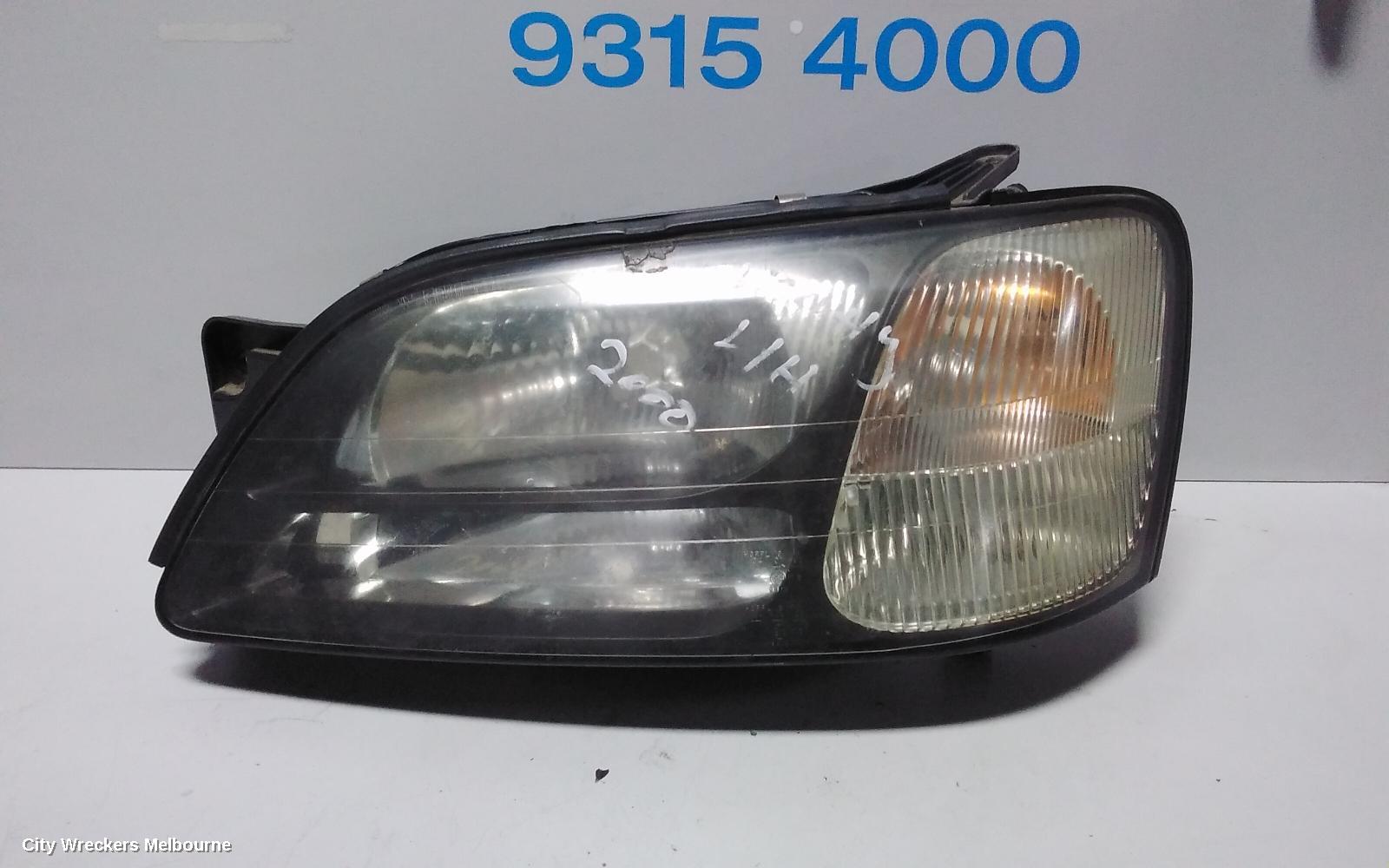 SUBARU LIBERTY LEFT HEADLAMP, 3RD GEN, BLACK INSERT, 11/1998 - 06/2001