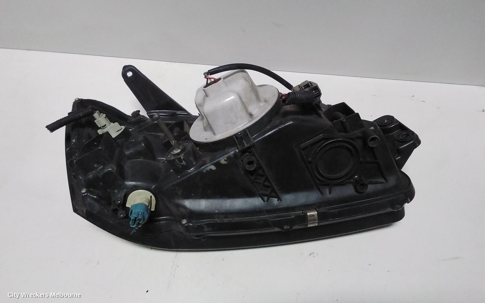 SUBARU LIBERTY LEFT HEADLAMP, 3RD GEN, BLACK INSERT, 11/1998 - 06/2001