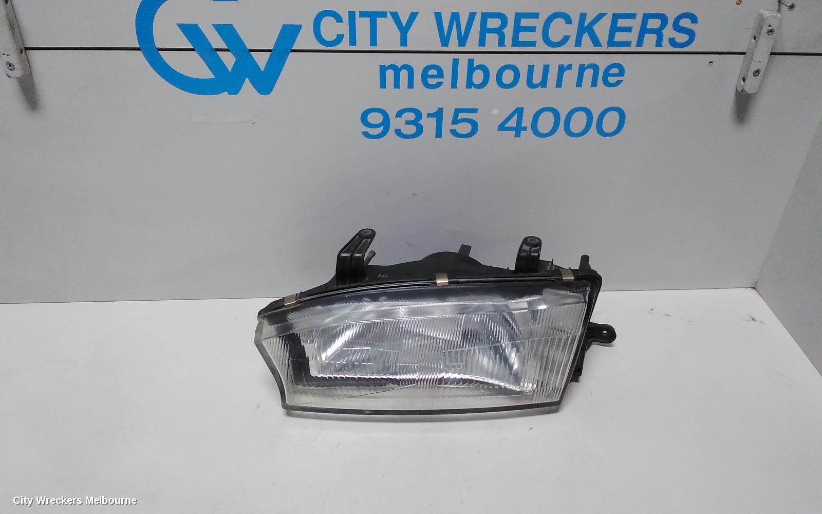 SUBARU LIBERTY LEFT HEADLAMP, 2ND GEN, KOITO LENS# 100-20588, 06/1994 - 01/1999