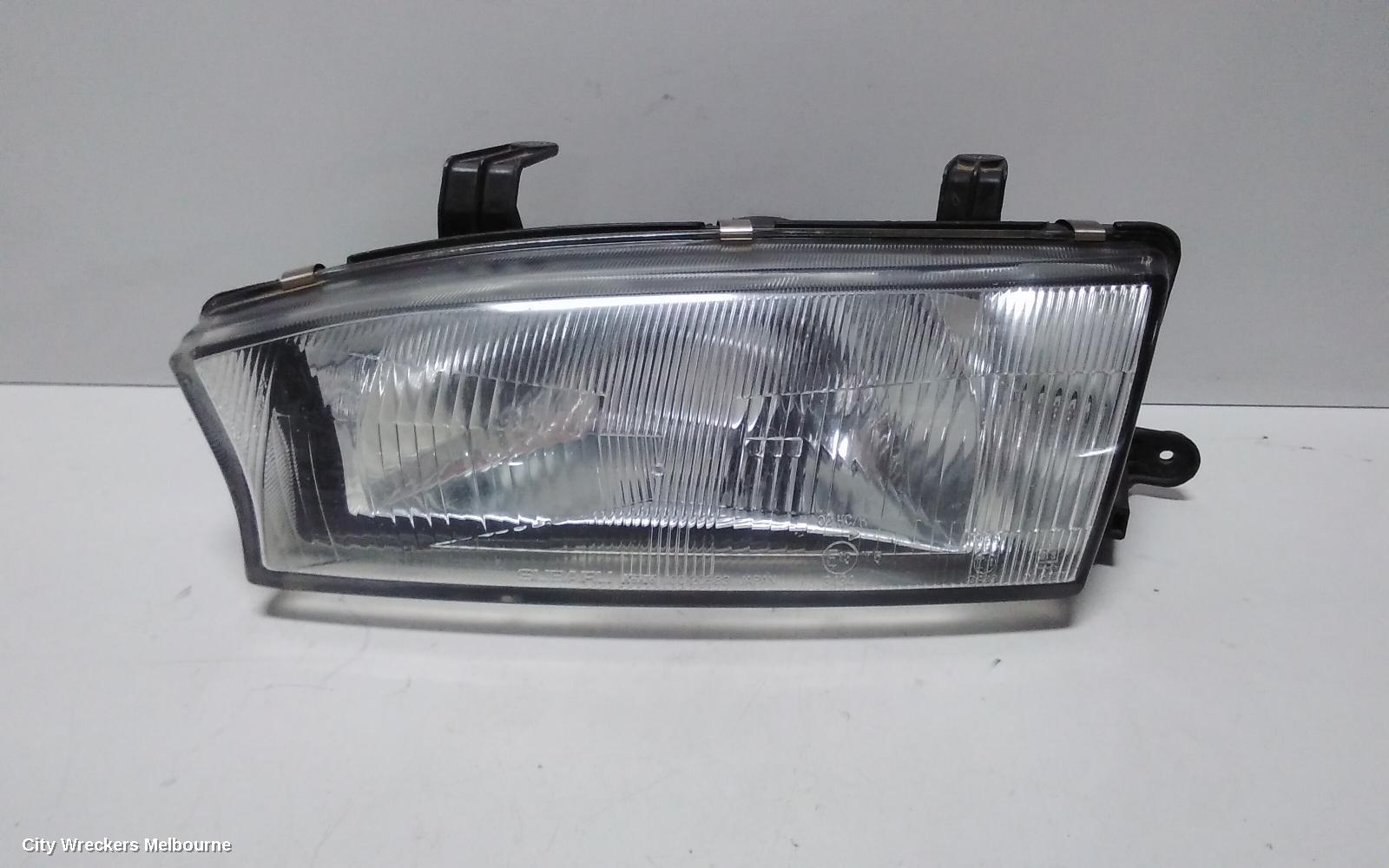SUBARU LIBERTY LEFT HEADLAMP, 2ND GEN, KOITO LENS# 100-20588, 06/1994 - 01/1999