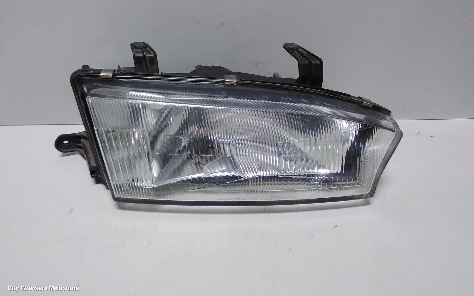 SUBARU LIBERTY RIGHT HEADLAMP, 2ND GEN, KOITO LENS# 100-20588, 06/1994 - 01/1999